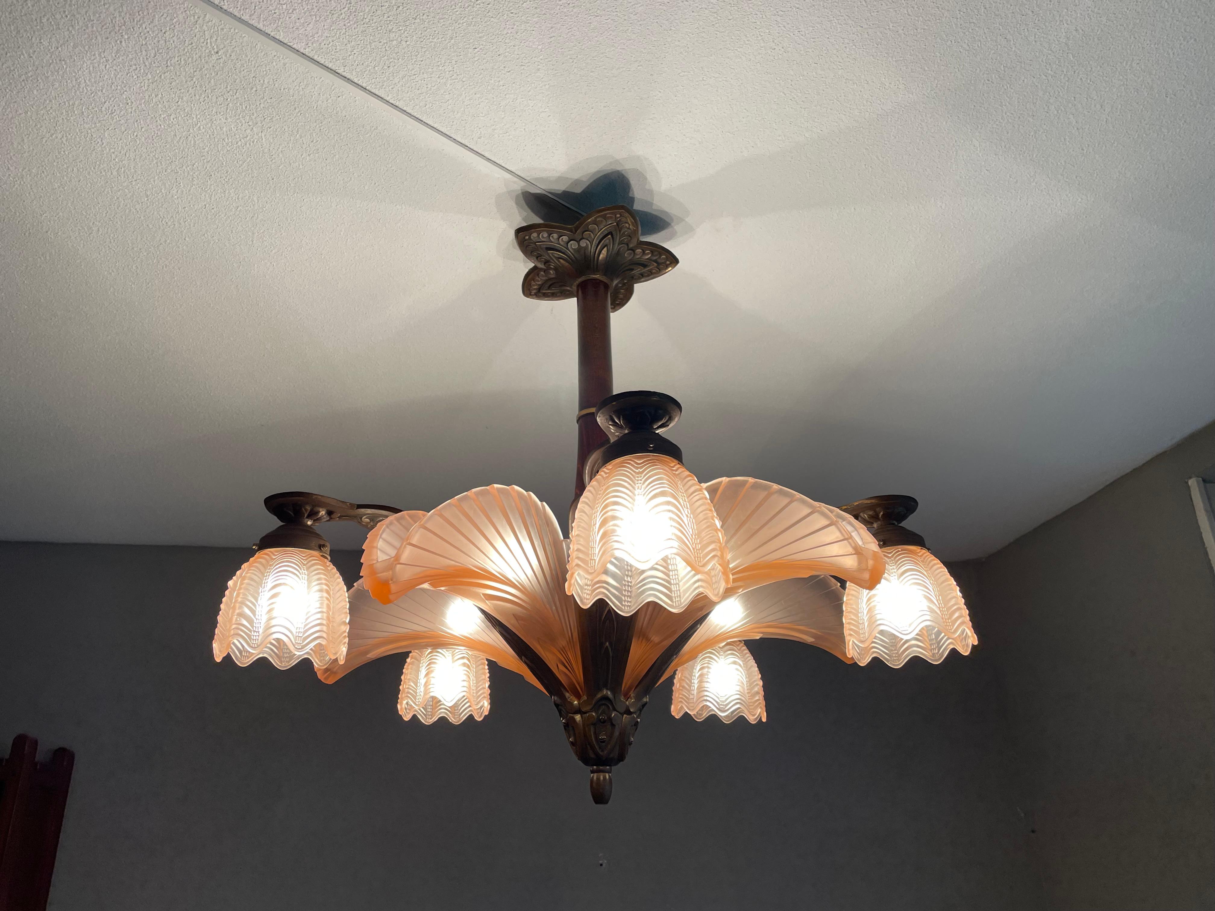 Top quality and practical size, ten-light Art Deco pendant.

This highly stylish Art Deco light fixture was handcrafted in Belgium and we think it was made by Verrerie Belge. The stunning Art Deco design and the quality of the materials lead us to