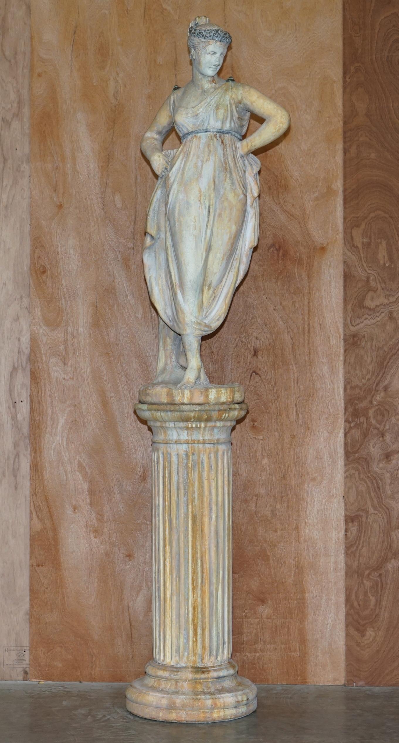 We are delighted to offer this exquisite signed TG stone neoclassical figure with bronze and pewter mounts standing on a pedestal base 

A beautifully weathered piece, the form and expression of the maiden is pure neoclassical elegance. The good
