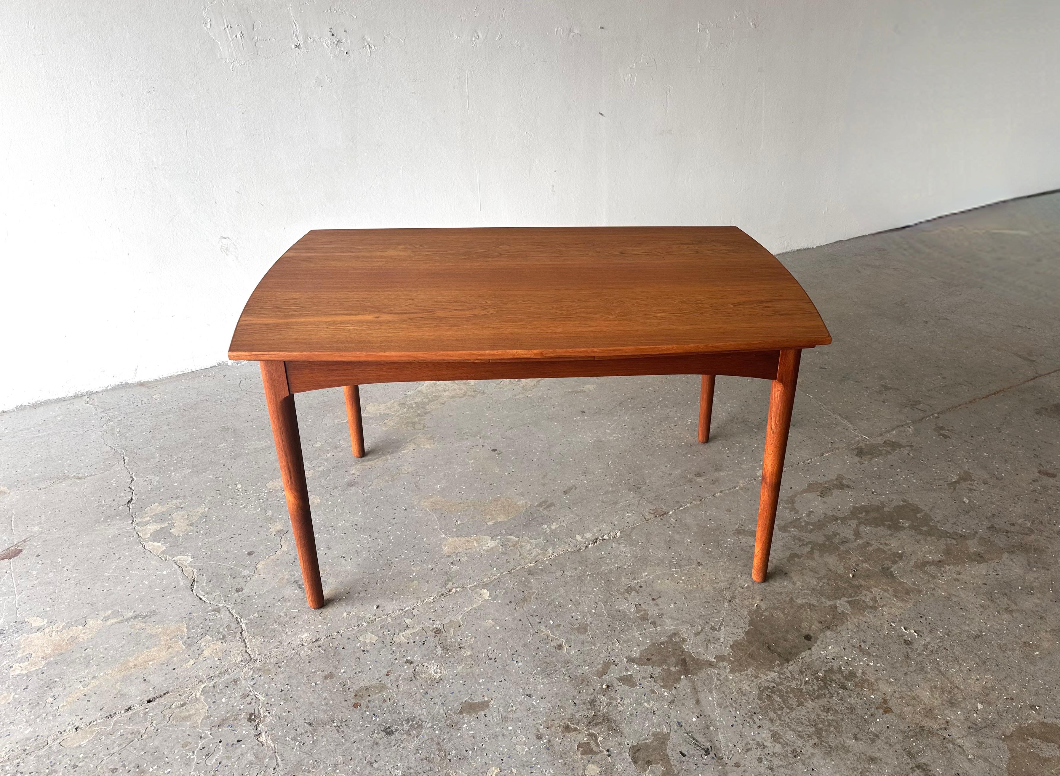 
Stunning 1960's Danish Modern Teak Dining Table
Crafted from rich, warm teak , this table exudes elegance and sophistication. Its sleek, minimalist design is enhanced by the natural grain of the teak  showcasing the beauty of its original