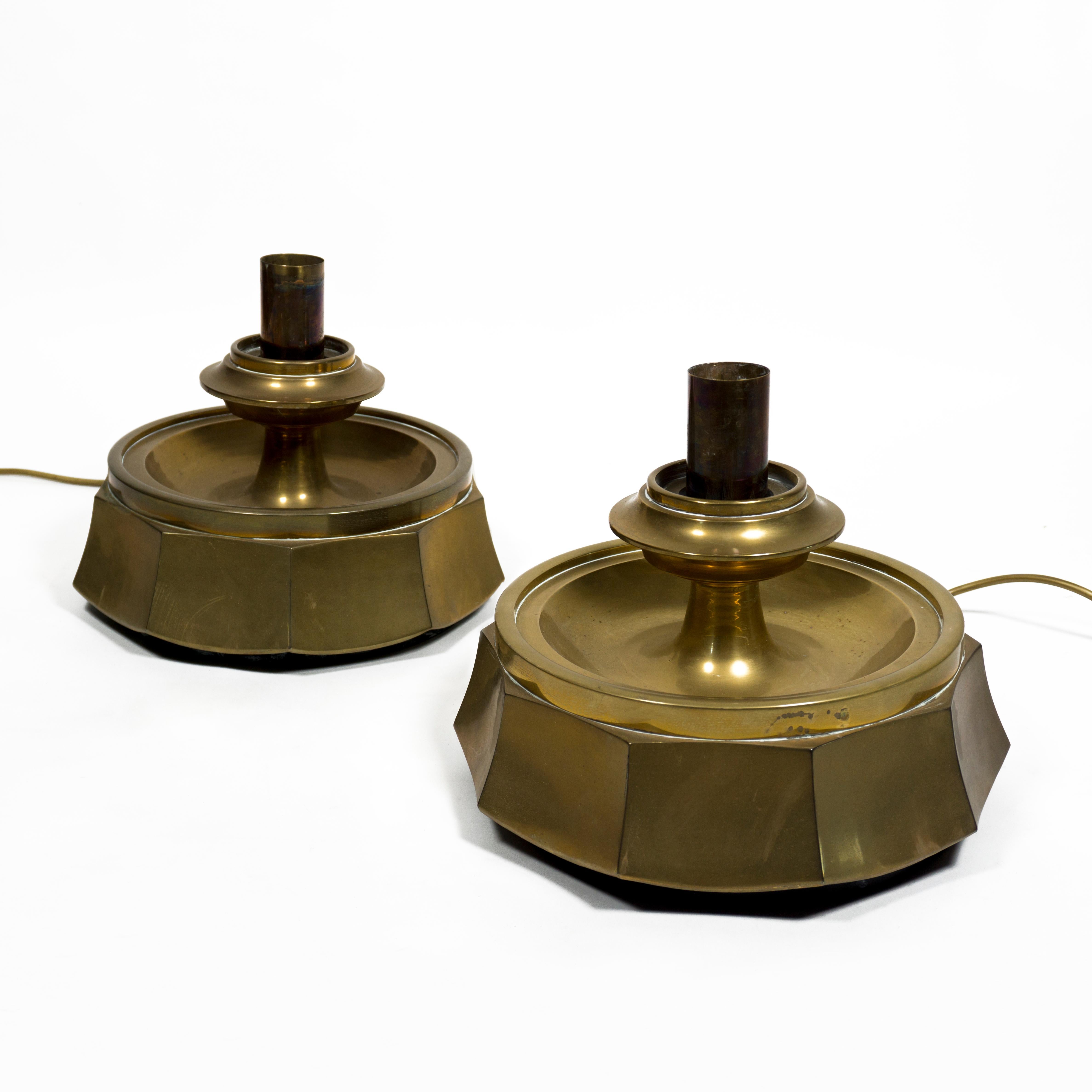 Beautiful set consisting of two heavy brass table lamps from the 1960s. 
These beautiful lamps come from a church in Germany and are both lighting and sculpture. 
Each of the table lamps weighs 7.5 kg.
Great design with high quality workmanship. 1