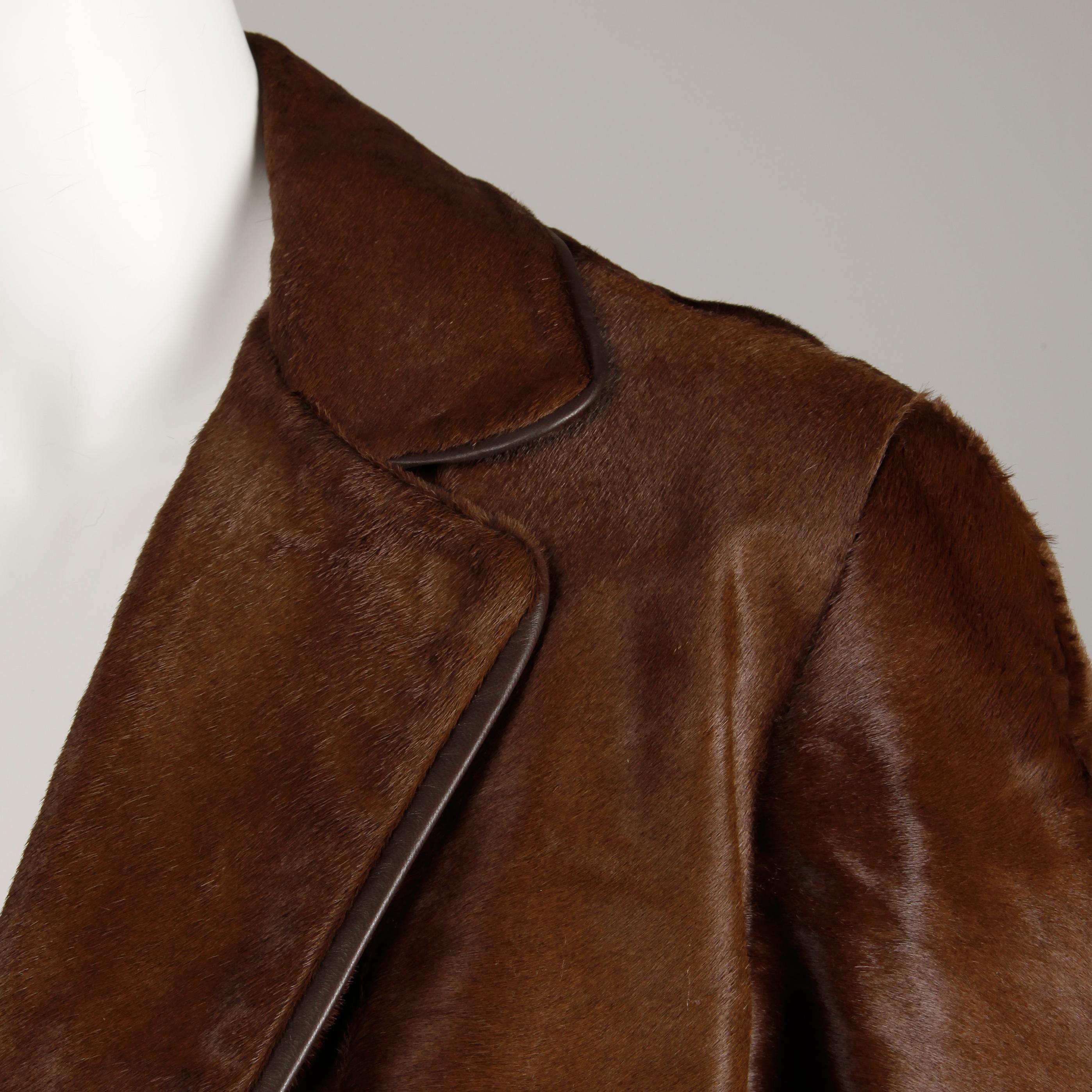 Stunning vintage brown fur coat from the 1960s in incredible condition (rare to find one of these without balding). Drop waist and pleated detail in the bottom back. Fully lined with front double button closure. Hidden side pockets. Fits like a