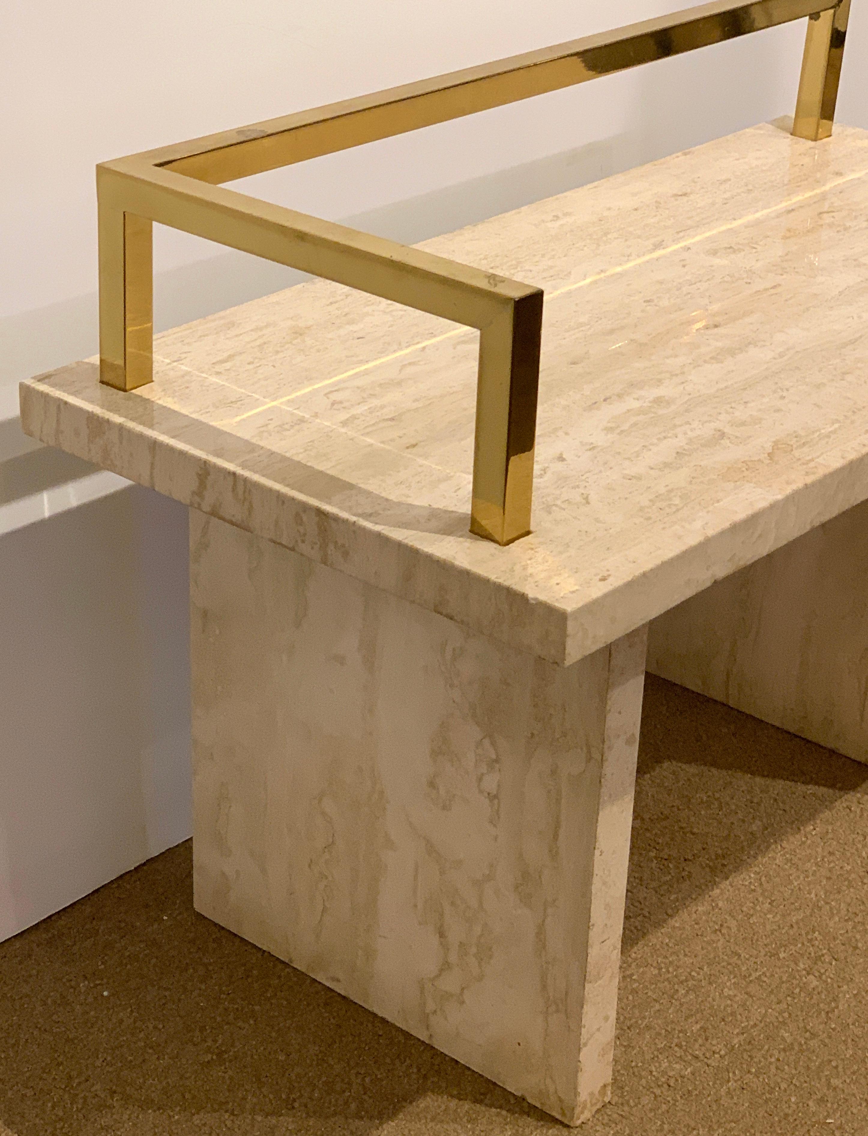 Stunning 1970s brass and travertine monolithic bench, simplistic, and sublime, perfect anywhere indoors and out, even bathroom/shower application. Height of the bench to the top of brass gallery is 26