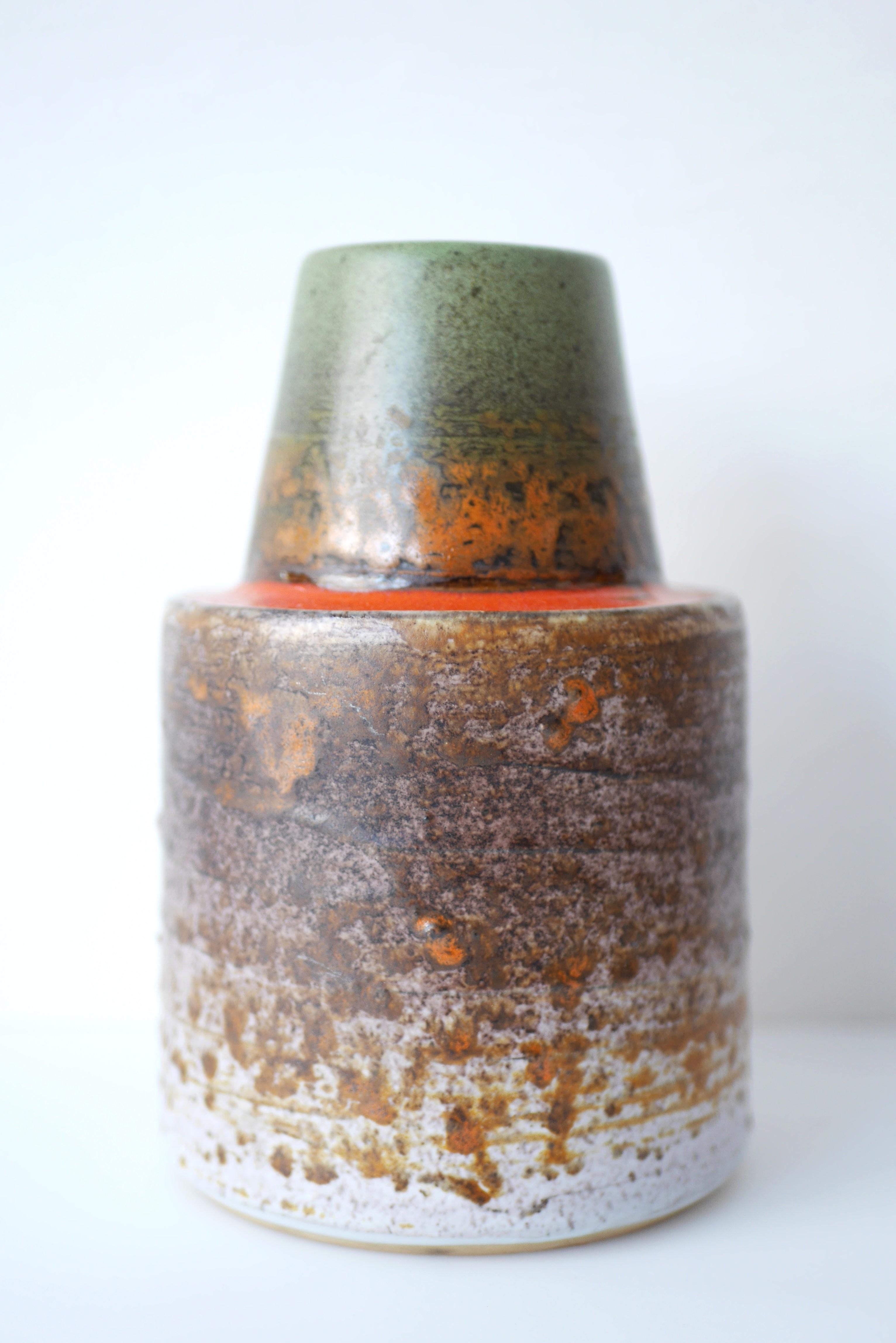 An extraordinary vintage art ceramic vase from Tilgmans, Sweden. This vase is out of the ordinary the shape is voluptuous still simple, this in combination of a fantastic glazing makes this object really to stand out. The glazing is a sign of true
