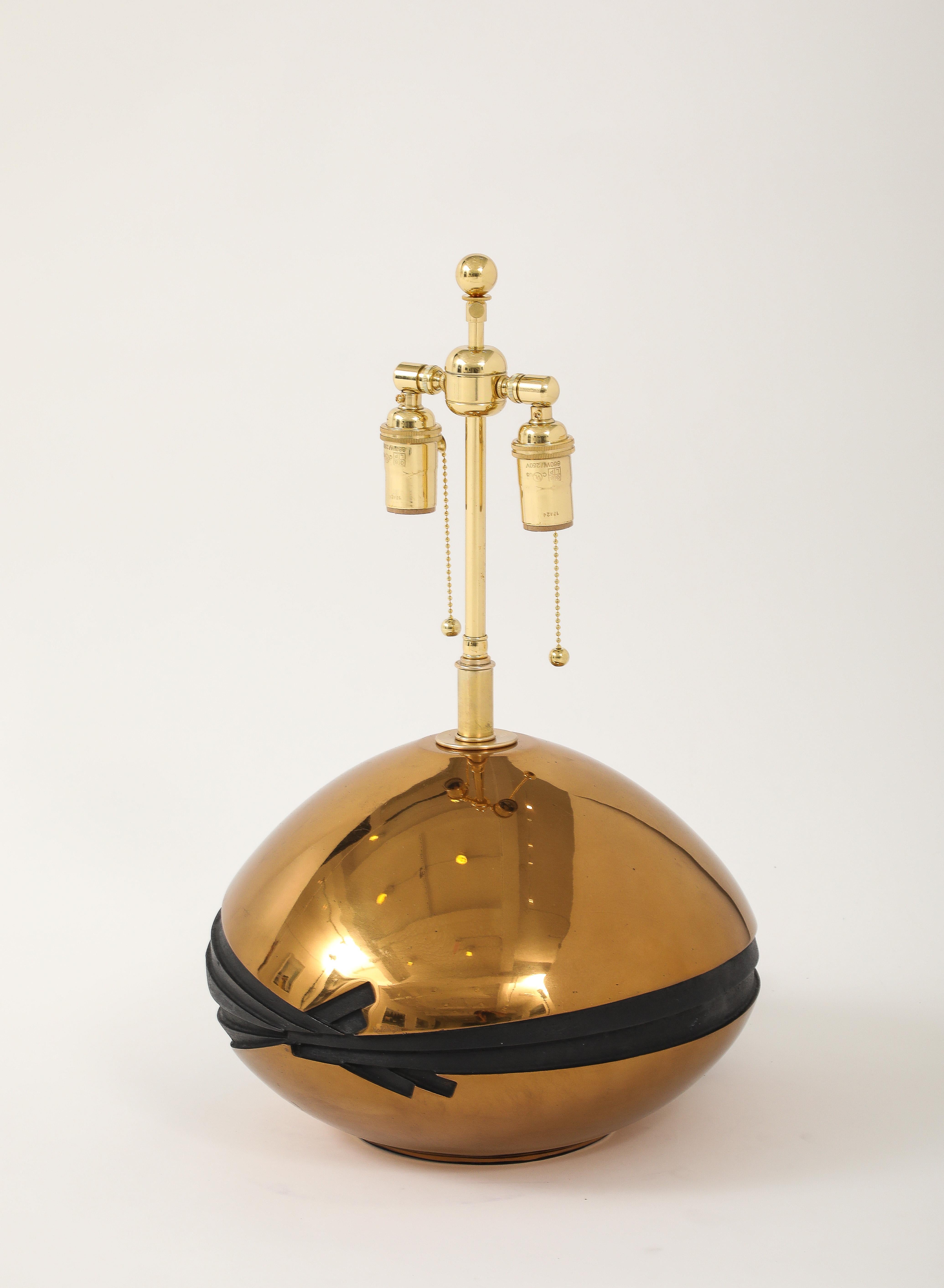 Stunning 1980's Brass and Bronze sculptural table lamp signed by ESA Fedrigolli.
This Futuristic designed table lamp in complementing Bronze and Brass has been Newly 
rewired for the US with adjustable polished brass double cluster and silk rayon