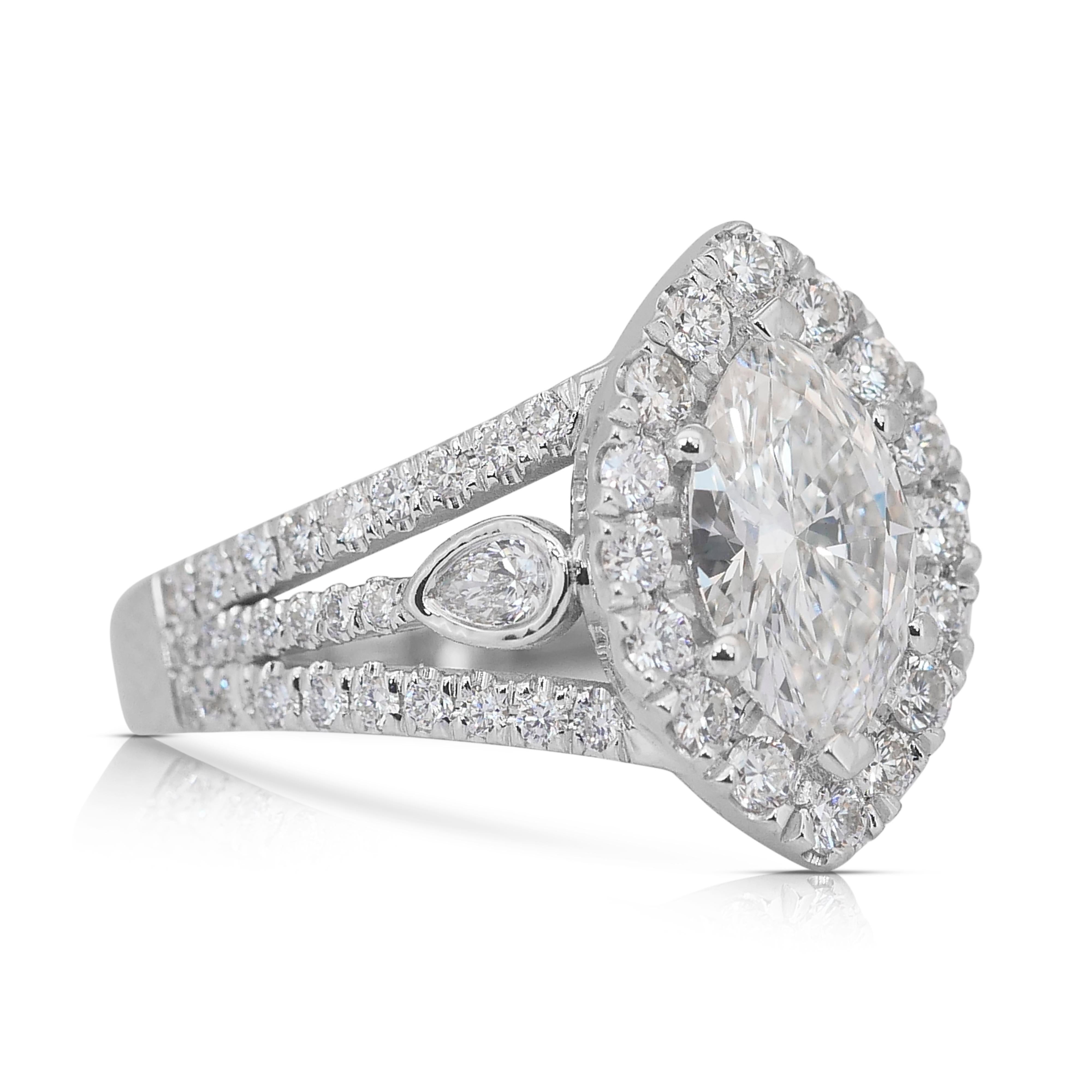 Stunning 1.99ct Diamonds Halo Ring in 18k White Gold - IGI Certified

Exude grace and brilliance with this breathtaking 18k white gold diamond ring, featuring a 1.13ct marquise-cut diamond as its dazzling centerpiece. Two luminous pear-cut side