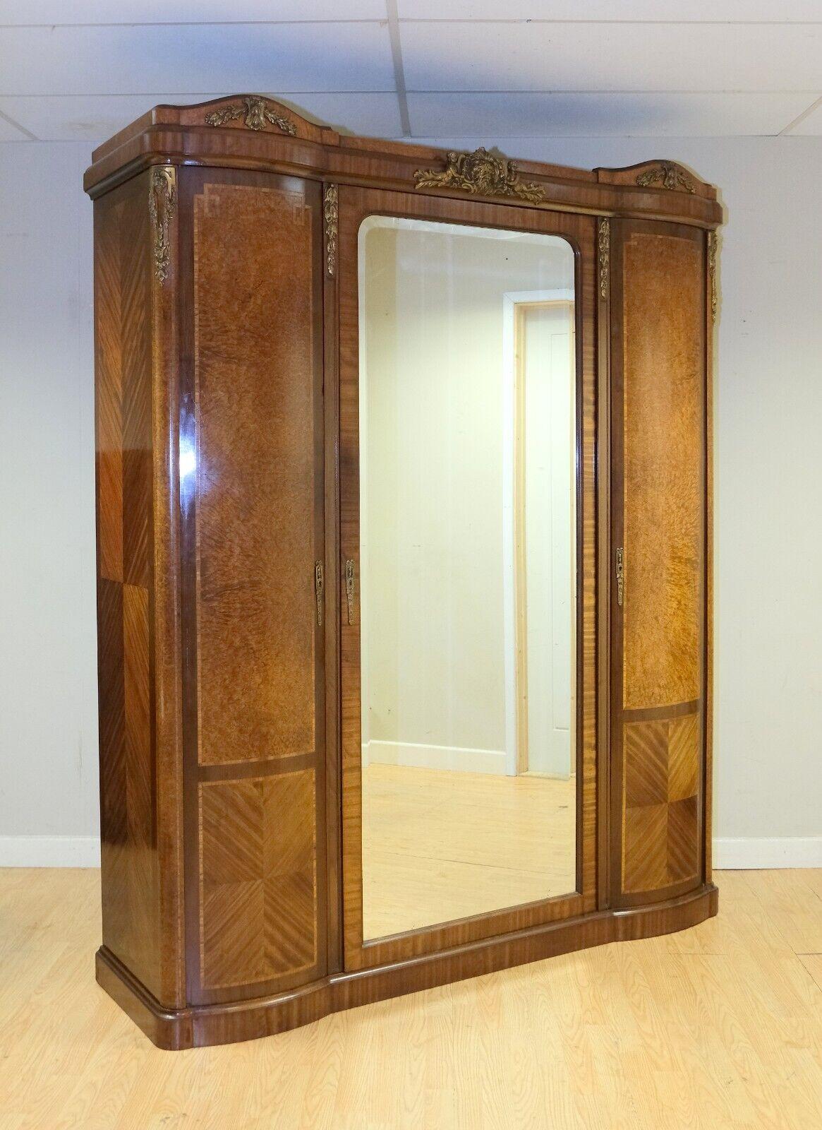 We are delighted to offer for sale this stunning 19th-century French triple wardrobe with gilt molds and a central door mirror. 

For start, this stunning piece is gorgeous from any point of view as it is well presented with a lovely mold of angels,