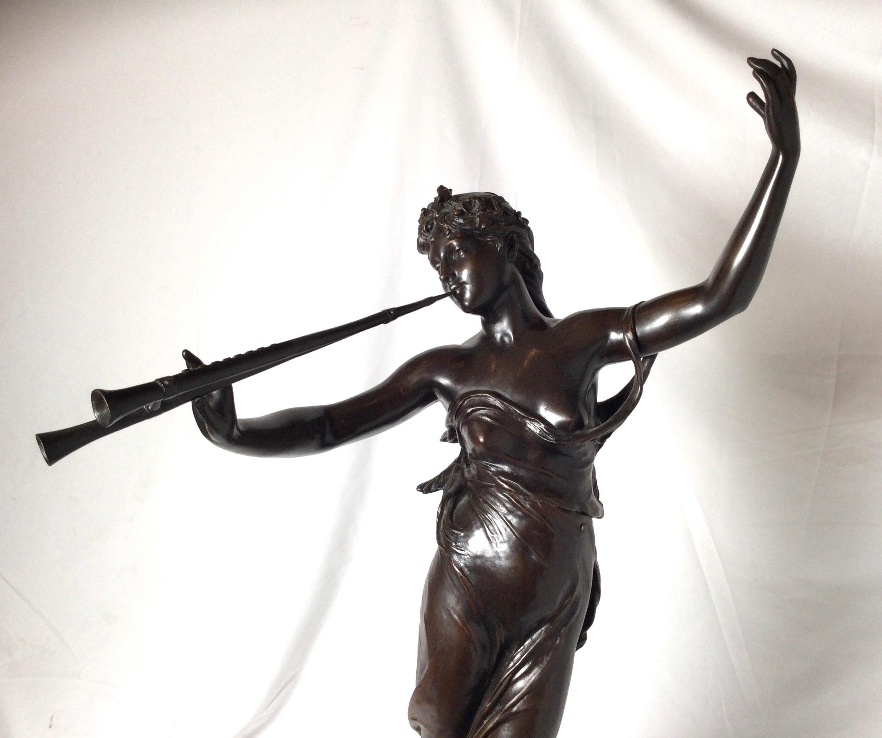 A patinated bronze figure of an Art Nouveau fiure of a woan with a flute. The sculpture with signature towards the base with a gilt bronze mount. Measures: 32 inches tall.
Eugène Marioton, born in Paris on April 7, 1857, was a French sculptor