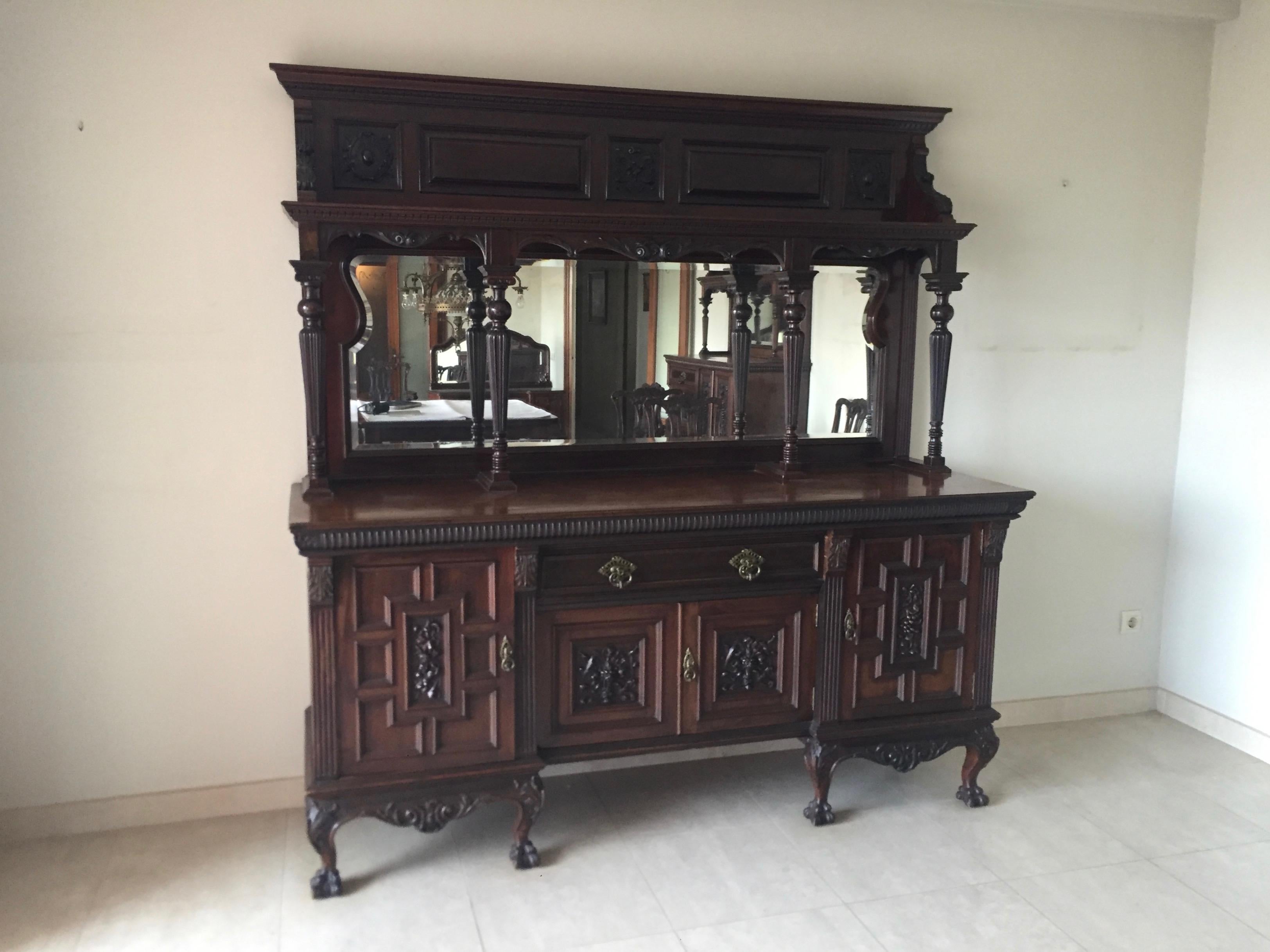 Stunning English 19th century large Chippendale style ball and claw buffet or cabinet with mirror on top. The piece was made in London, circa 1890s.
The piece is divided into two parts. The sideboard table and the mirror, decorated with ionic