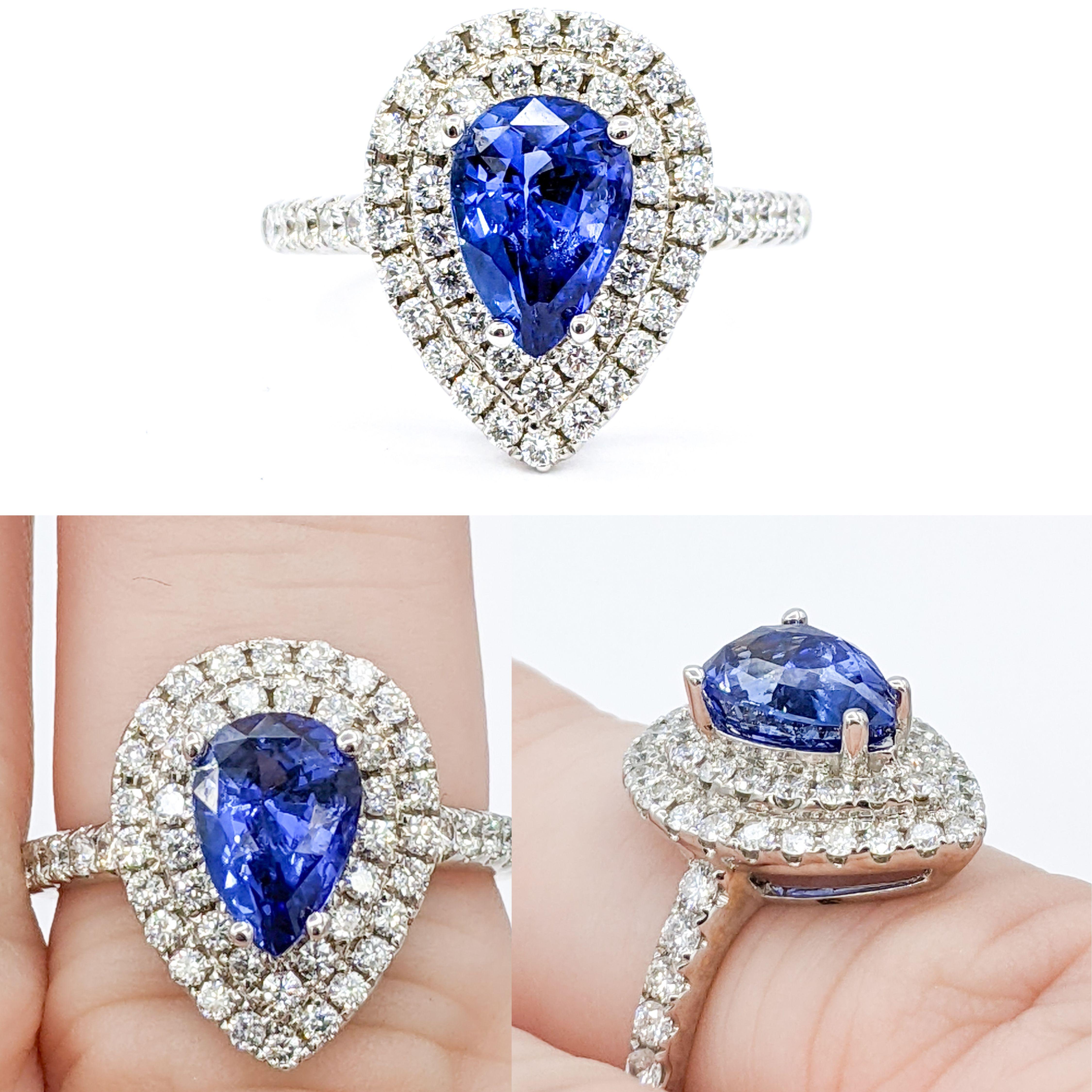 Elevate your elegance with our Stunning Sapphire & Diamond Cocktail Ring, an embodiment of sophistication and timeless luxury.

At the centerpiece of this majestic ring is a 2.00ct pear-cut sapphire, a stone renowned for its deep, enchanting hues