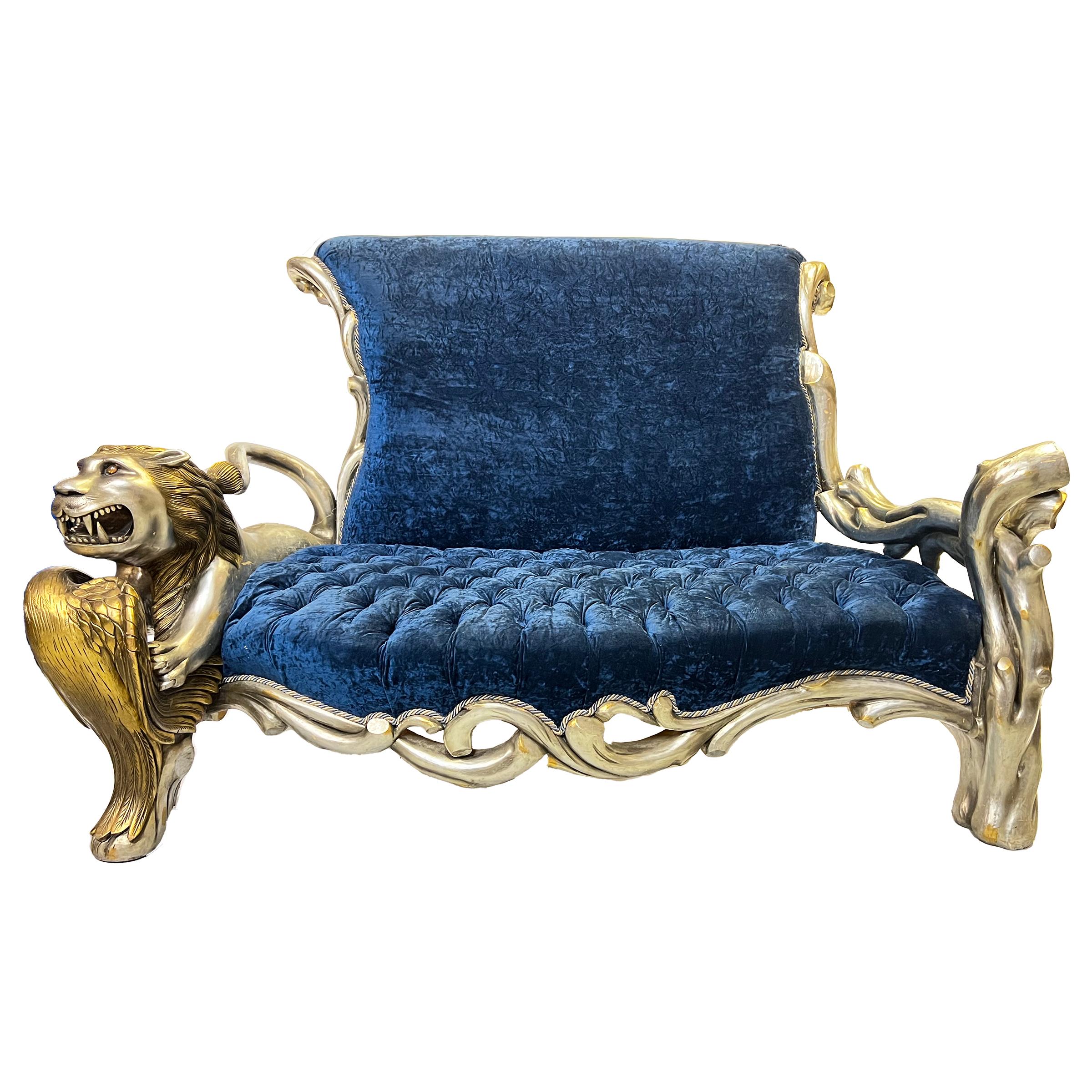 This stunning sofa features a blue velvet textile that is soft to the touch and adds a touch of luxury to any room. One side of the sofa features a playful design of lion and swan, while the other side features a more natural design of tree