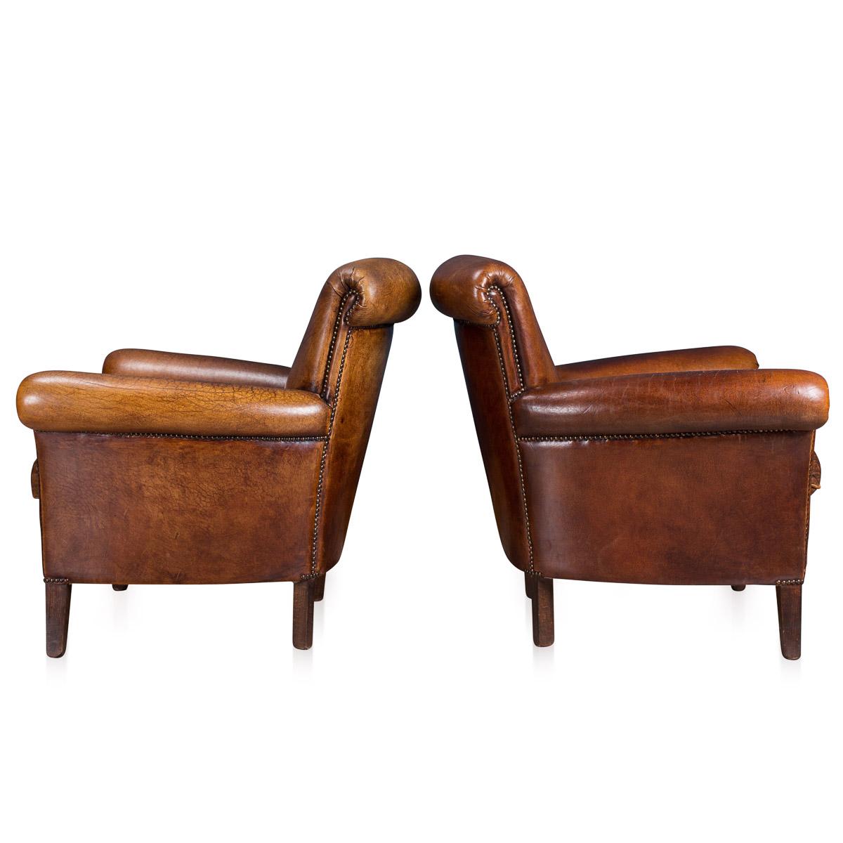 Showing superb patina and color, this wonderful pair of club chairs were hand upholstered sheepskin leather in Holland by the finest craftsmen. Fantastic look for any interior, both modern and traditional.
 
Condition:

In excellent condition -