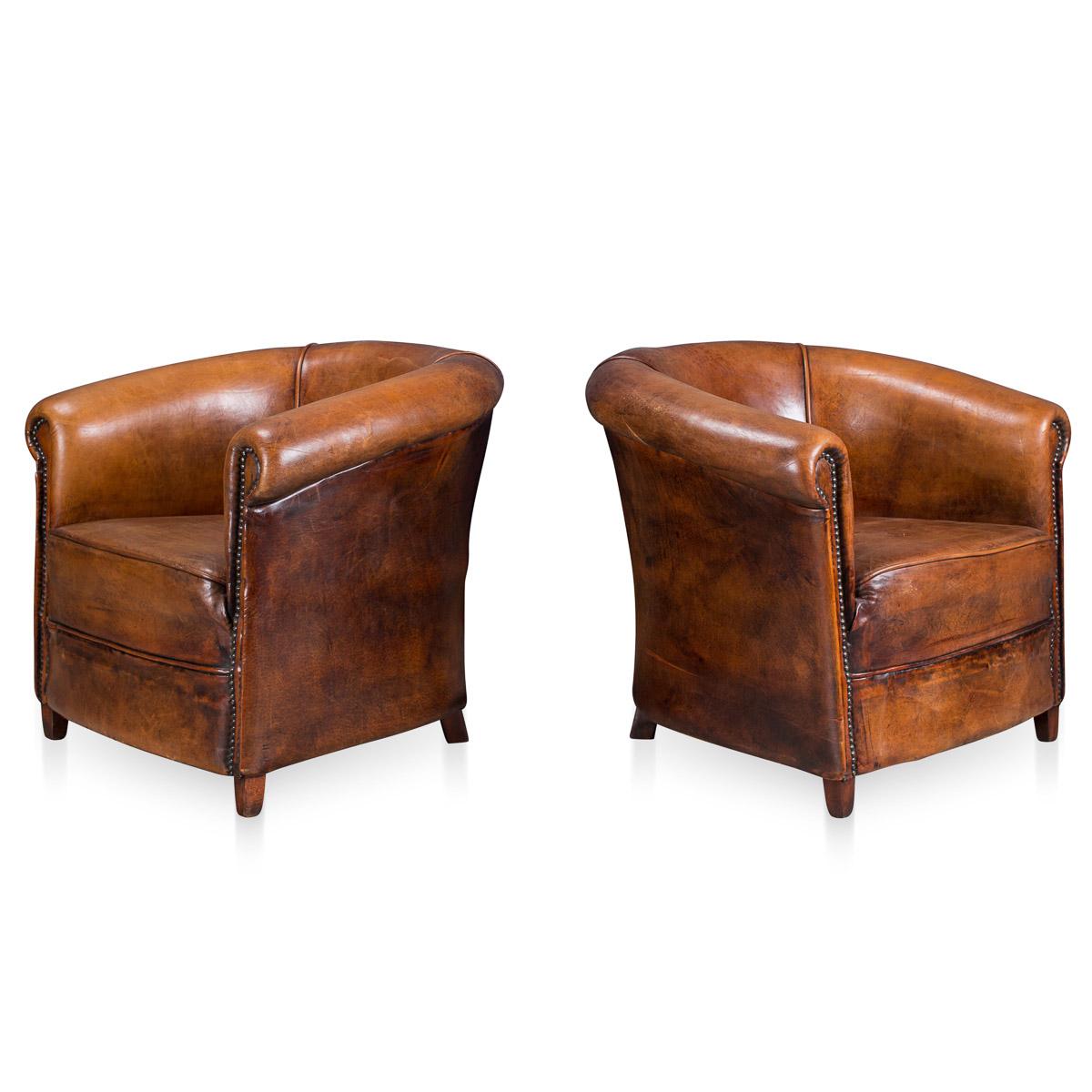 Showing superb patina and color, this wonderful pair of tub chairs were hand upholstered sheepskin leather in Holland by the finest craftsmen. Fantastic look for any interior, both modern and traditional.
 
Condition:

In excellent condition, no