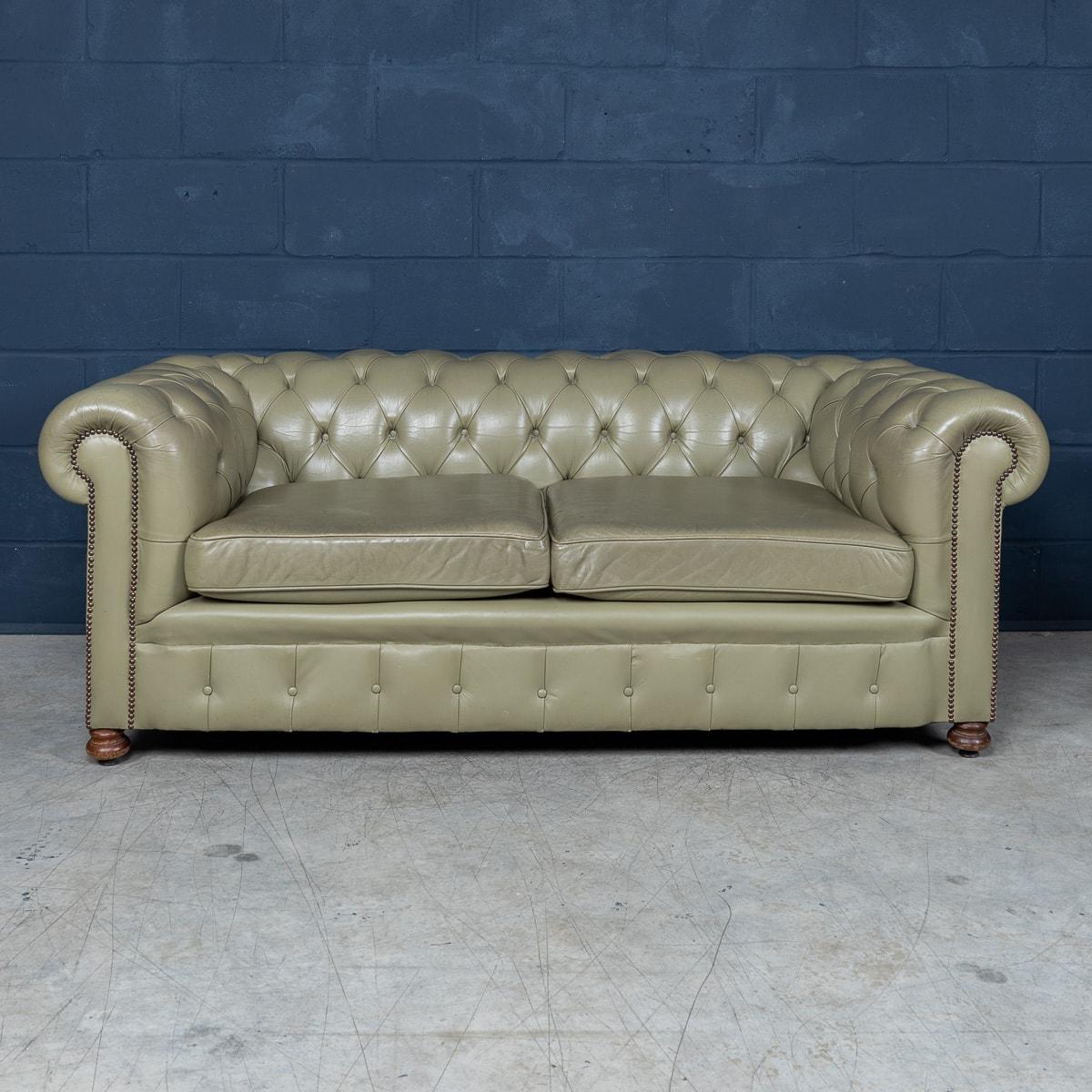 A superb late 20th century olive green leather chesterfield sofa. This is a fashionable item of furniture capable of uplifting the interior space of any contemporary or traditional home, the olive green colour combining refined elegance and