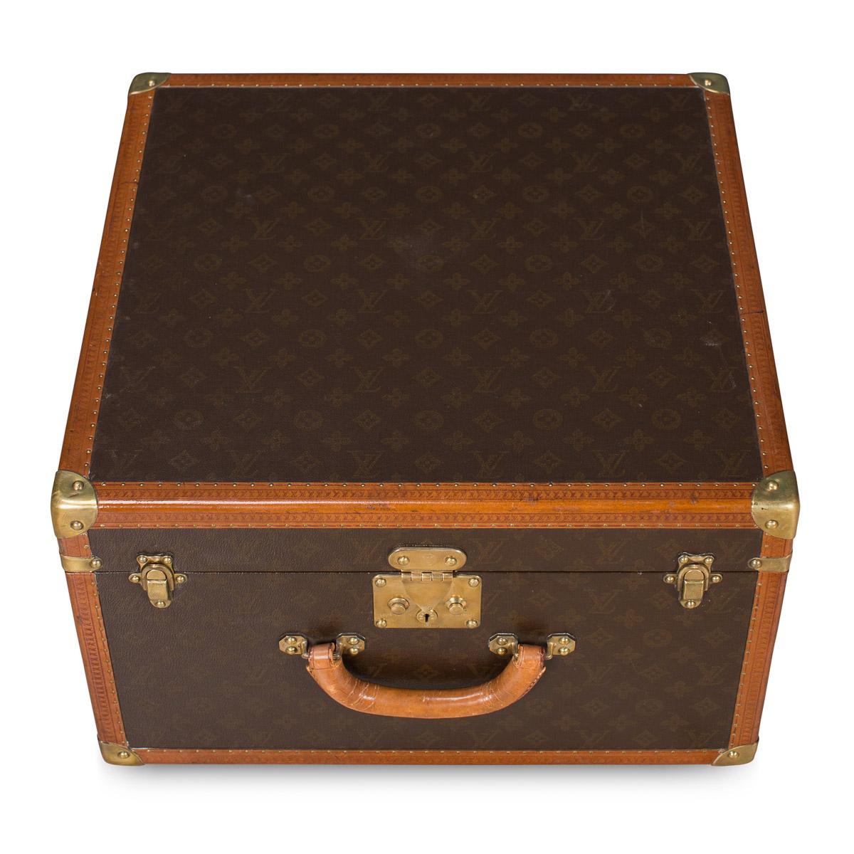 A charming Louis Vuitton cubed hat case, second half of the 20th century with original key and insert tray. The exterior finished in the famous monogram canvas with brass fittings, a great piece for use today or as an item for the