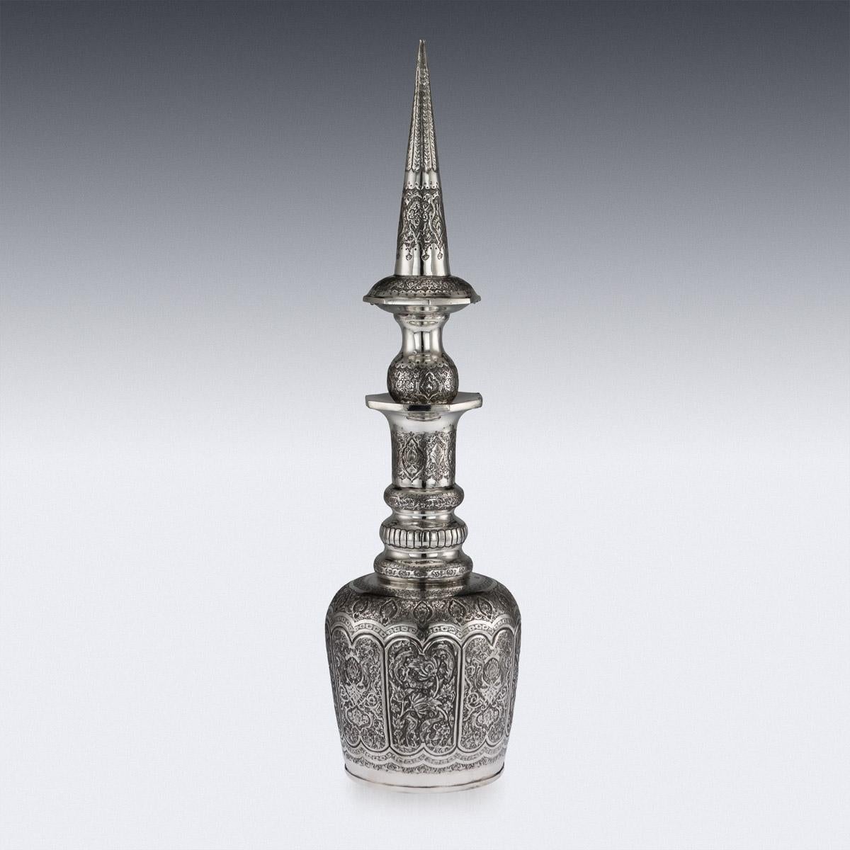 Stunning mid-20th century Persian solid silver massive decanter and stopper, of traditional form, beautifully decorated with detailed decorations typical to the region of Isfahan. Unmarked, tested (900+ silver standard).
 