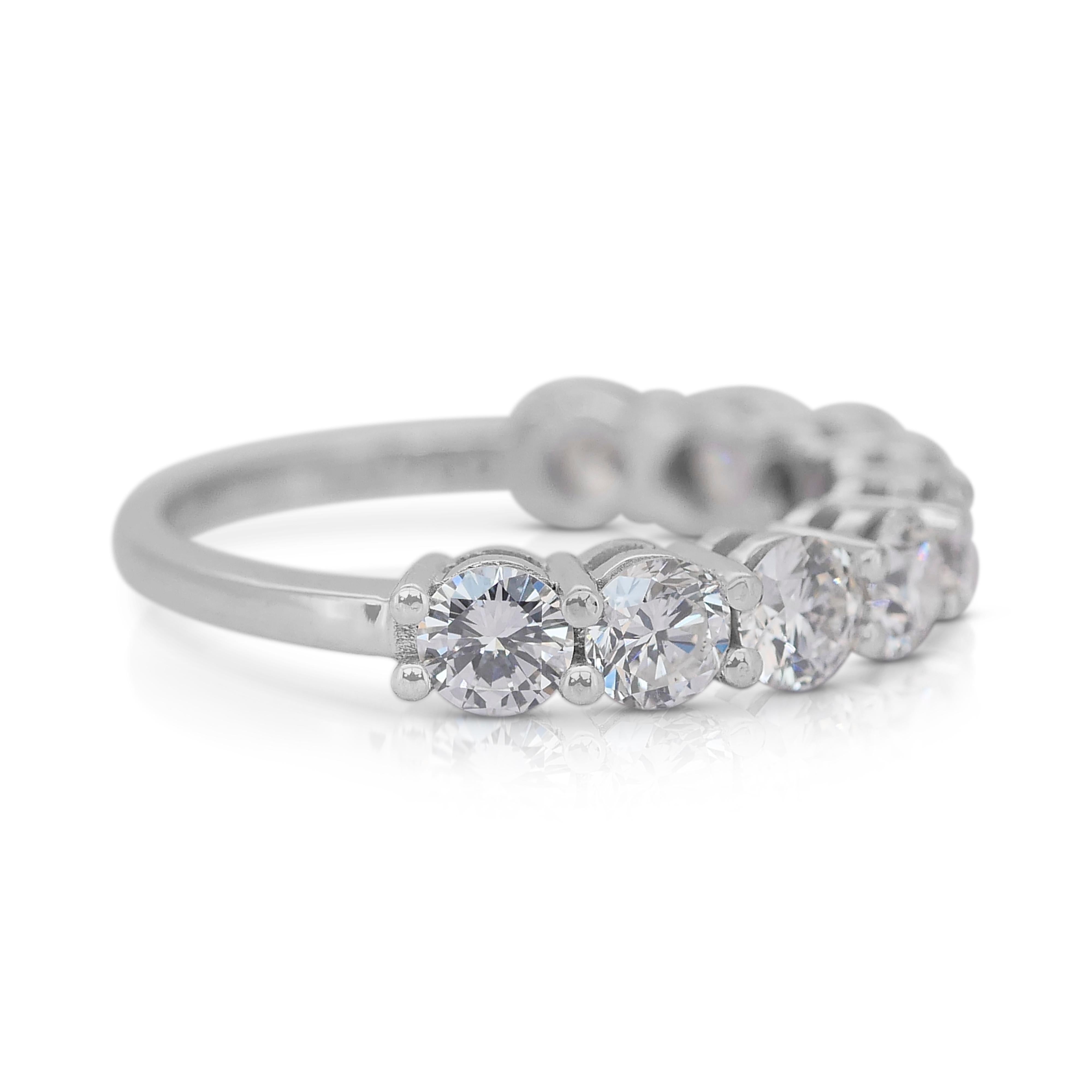 Stunning 2.23ct Diamonds Half-Eternity Ring in 18k White Gold - IGI Certified

This breathtaking half-eternity ring is meticulously crafted in luxurious 18k white gold, showcasing a harmonious blend of elegance and brilliance, and adorned with 9