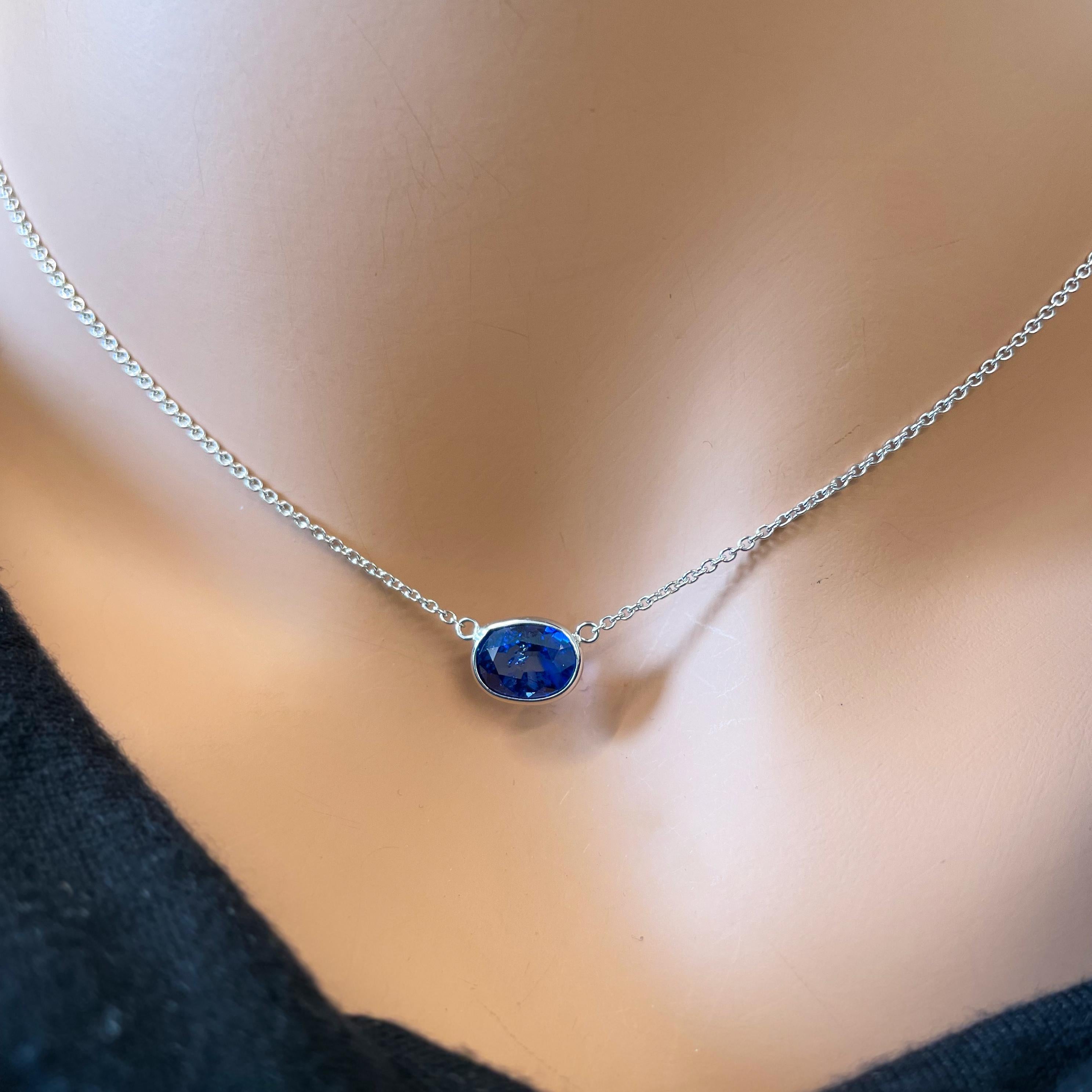 This fashion necklace features an oval-shaped blue sapphire weighing 2.29 carats, set in 14k white gold. The combination of the vibrant sapphire and the elegant white gold setting creates a timeless and stylish piece. This suggests the necklace is a