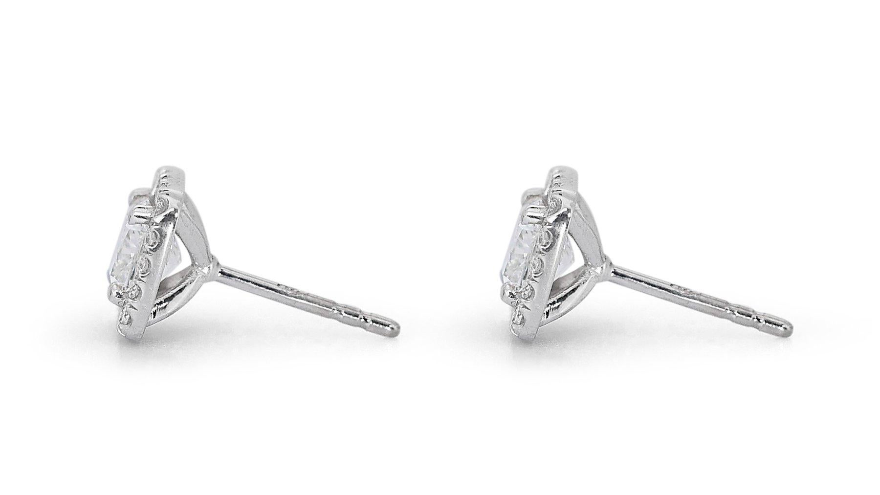 Stunning 2.33ct Diamond Halo Stud Earrings in 18k White Gold - GIA Certified

Elevate your elegance with these exquisite diamond halo earrings crafted from 18k white gold. The main stones are two captivating cushion-cut diamonds with a total carat