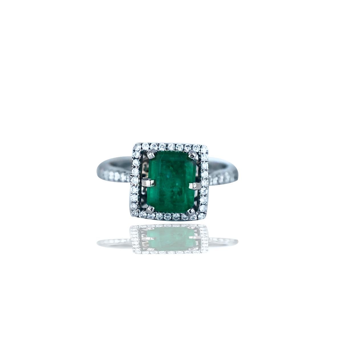Contemporary 2.48 Carat Colombian Emerald and Diamond Halo Ring
