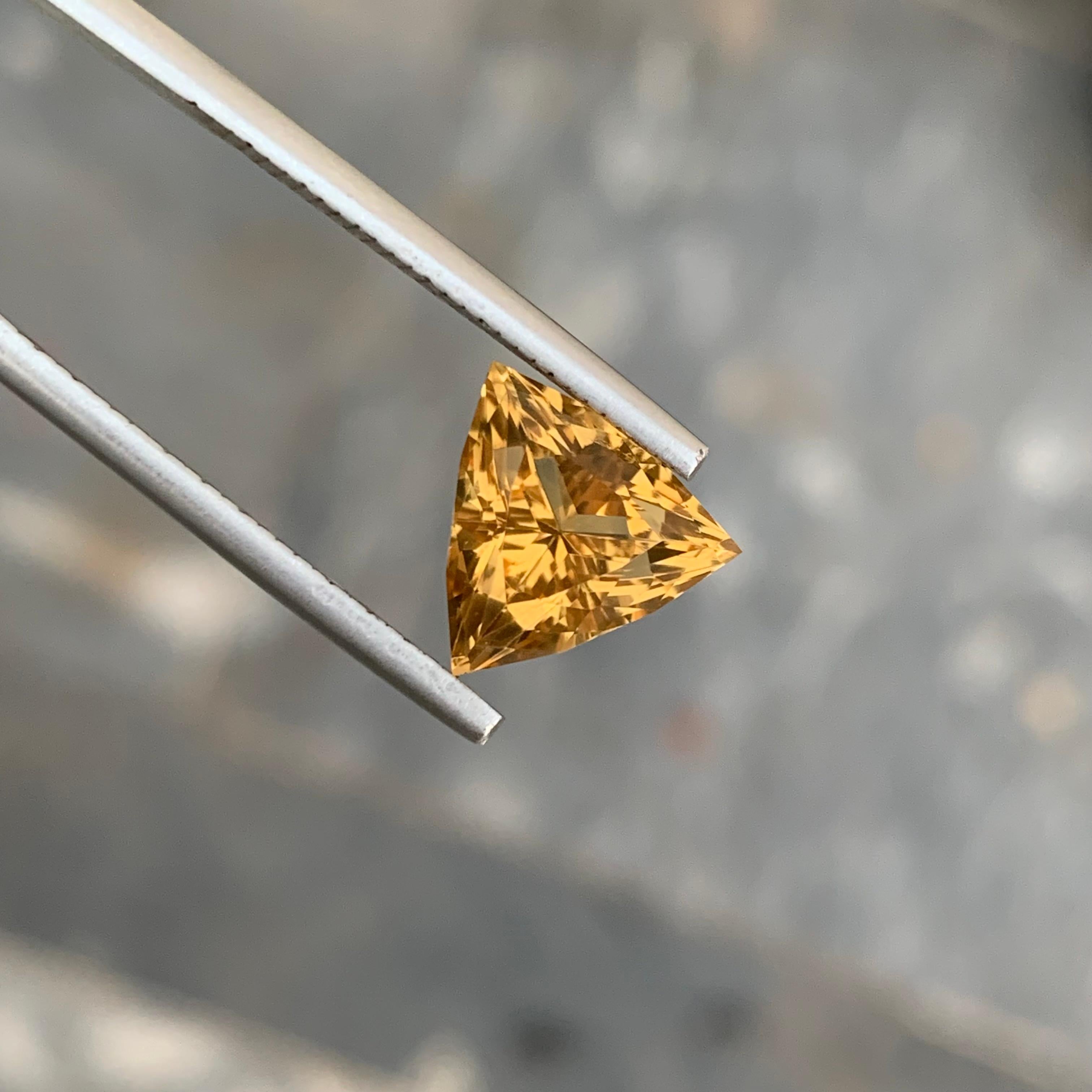 Loose Citrine 
Weight: 2.80 Carats 
Dimension: 9.8x9.8x6.5 Mm
Origin: Brazil
Shape: Trillion 
Color: Yellow
Treatment: Non
Citrine, a radiant gemstone known for its warm golden hues, holds a special place in the world of gemology. This transparent