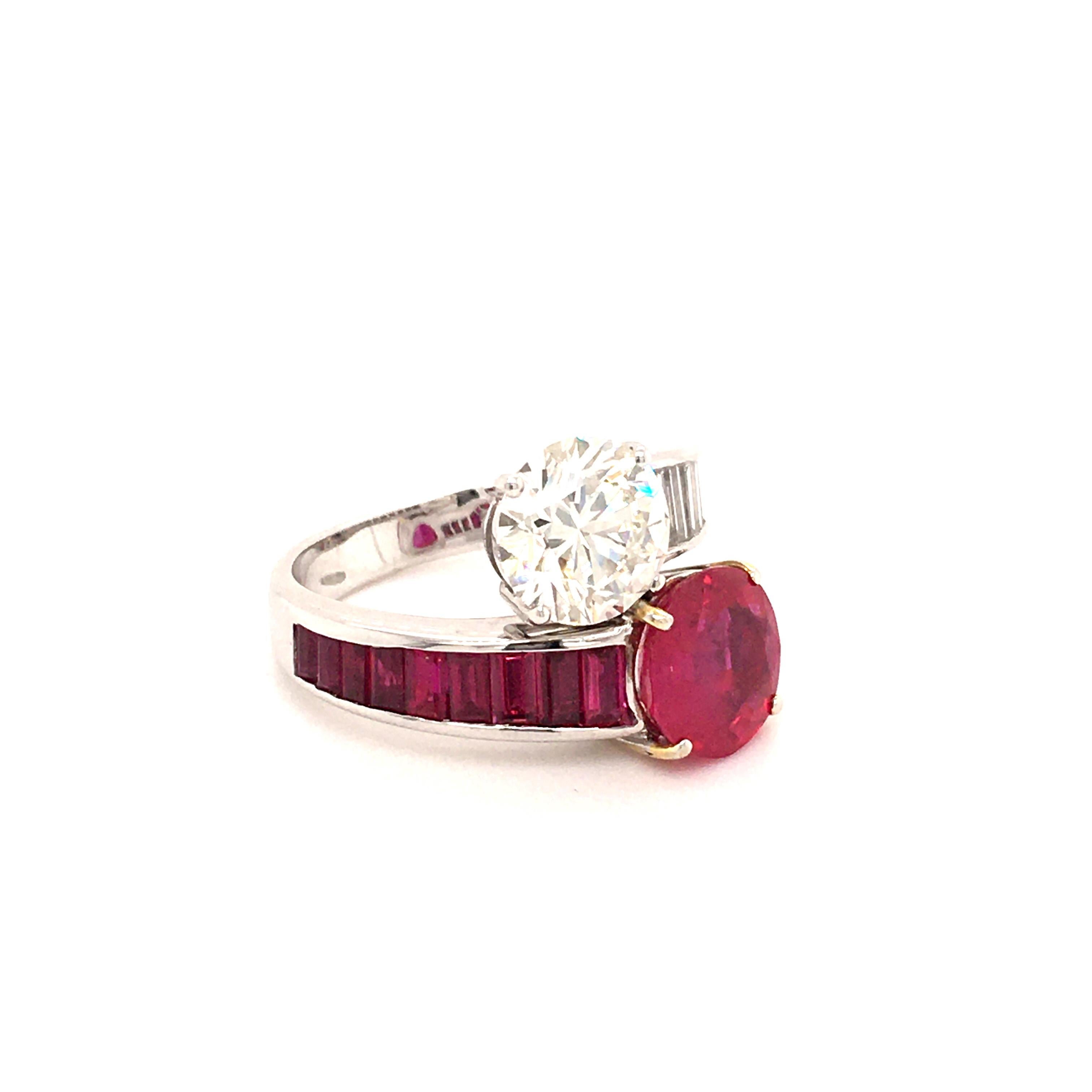 This stunning and fiery Toi et Moi ring in 18 karat white and yellow gold is set with a 2.81 ct unheated ruby from Burma and a 2.11 ct brilliant cut diamond of I color and vvs2 clarity. The elegantly curved shank is decorated with 9 baguette shaped