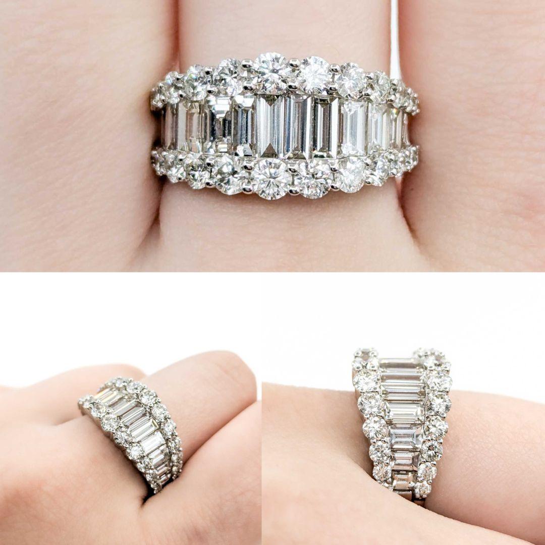 Stunning 3.38ctw Tapered Baguette Diamond Band Ring in White Gold

Crafted from luxurious 14k white gold, this sophisticated ring features a dazzling combination of baguette and round diamonds, totaling an impressive 3.83 carats. The carefully