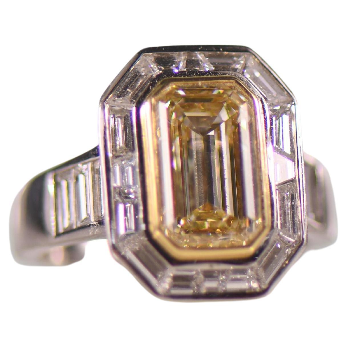Stunning 3.5 Carat Natural Yellow Emerald Cut Diamond in Custom Platinum Ring For Sale