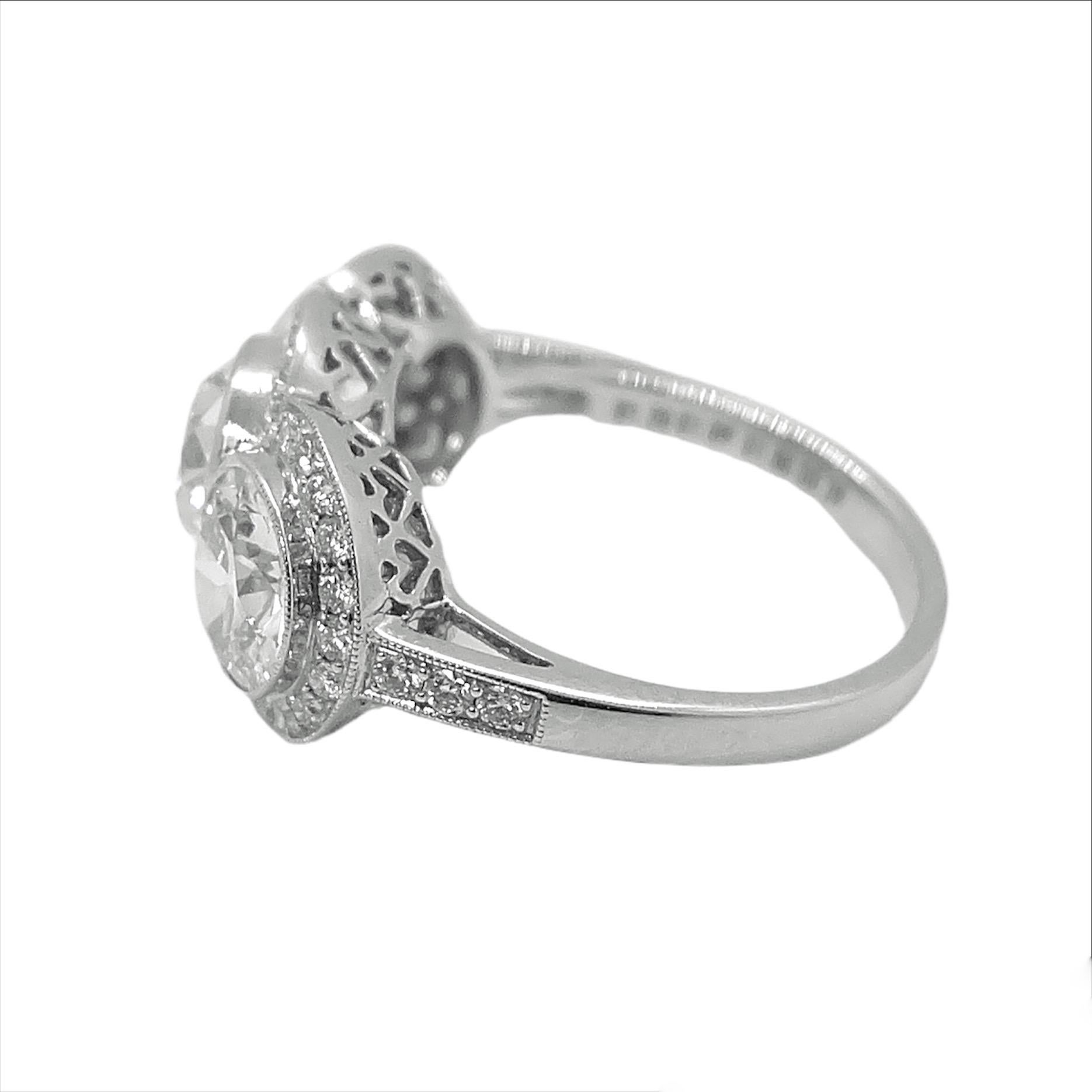 This stunning platinum ring centers a round cut diamond that weighs 1.20 carat flanked by two round cut diamonds that weigh 1.01-1.09 carat and surrounded by round cut diamonds that weighs 0.39 carat. 

Available for resizing.

Sophia D by Joseph
