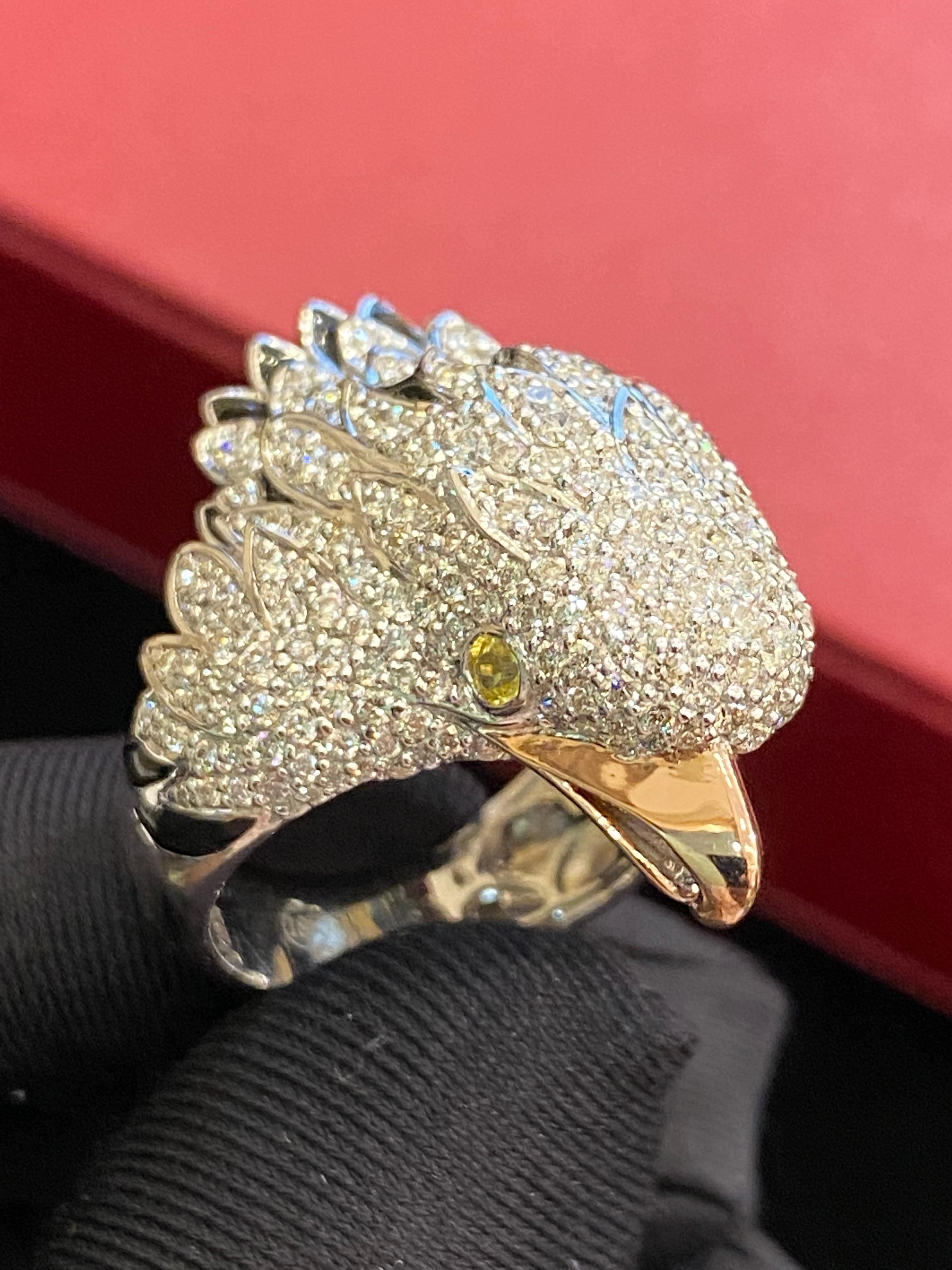 Elevate your style with this stunning Eagle-inspired ring, boasting 3.51 carats of brilliant F/VS1 natural diamonds and 0.20 carats of vibrant yellow sapphire set in luxurious 18K white gold. With its captivating design, this ring ensures you'll be