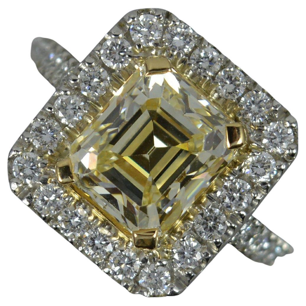 Stunning 3.75 Carat Yellow Diamond and Platinum Engagement Cluster Ring