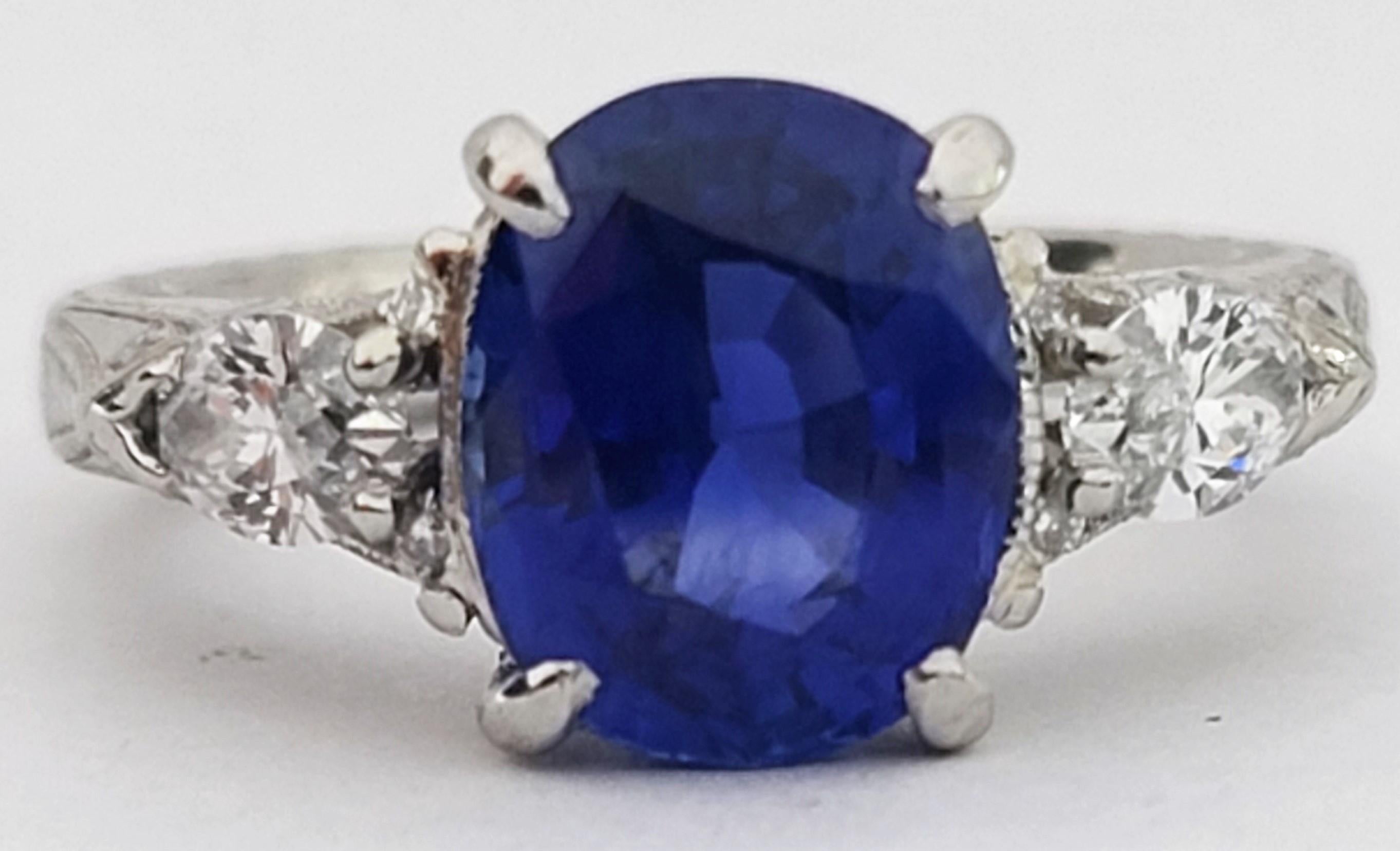 Stunning 3.91ct Natural Blue Sapphire 1.10ctw Diamond E-F VVS2-VS2 JBI Platinum Ring 10.8g Size 7.  Deep rich blue stunning natural sapphire with known weight of 3.91 carats, accented by two large nearly half carat each marquise diamonds that are
