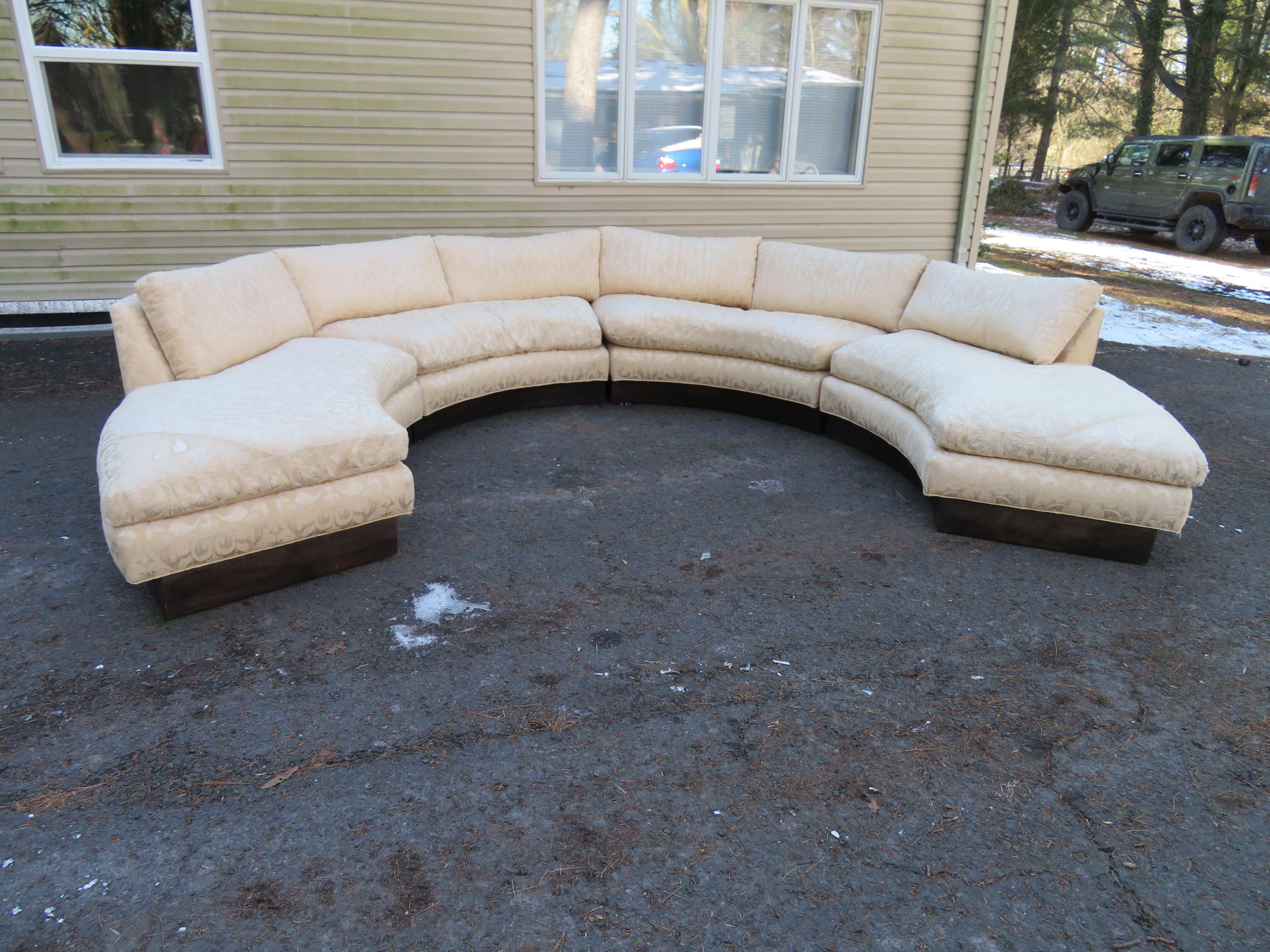 Stunning 4-piece circular Erwin Lambeth sectional sofa. This vintage sectional sofa is quality through and through from the down filled seat cushions to the thick solid walnut plinth base-very stylish. We love the two open end sections on either