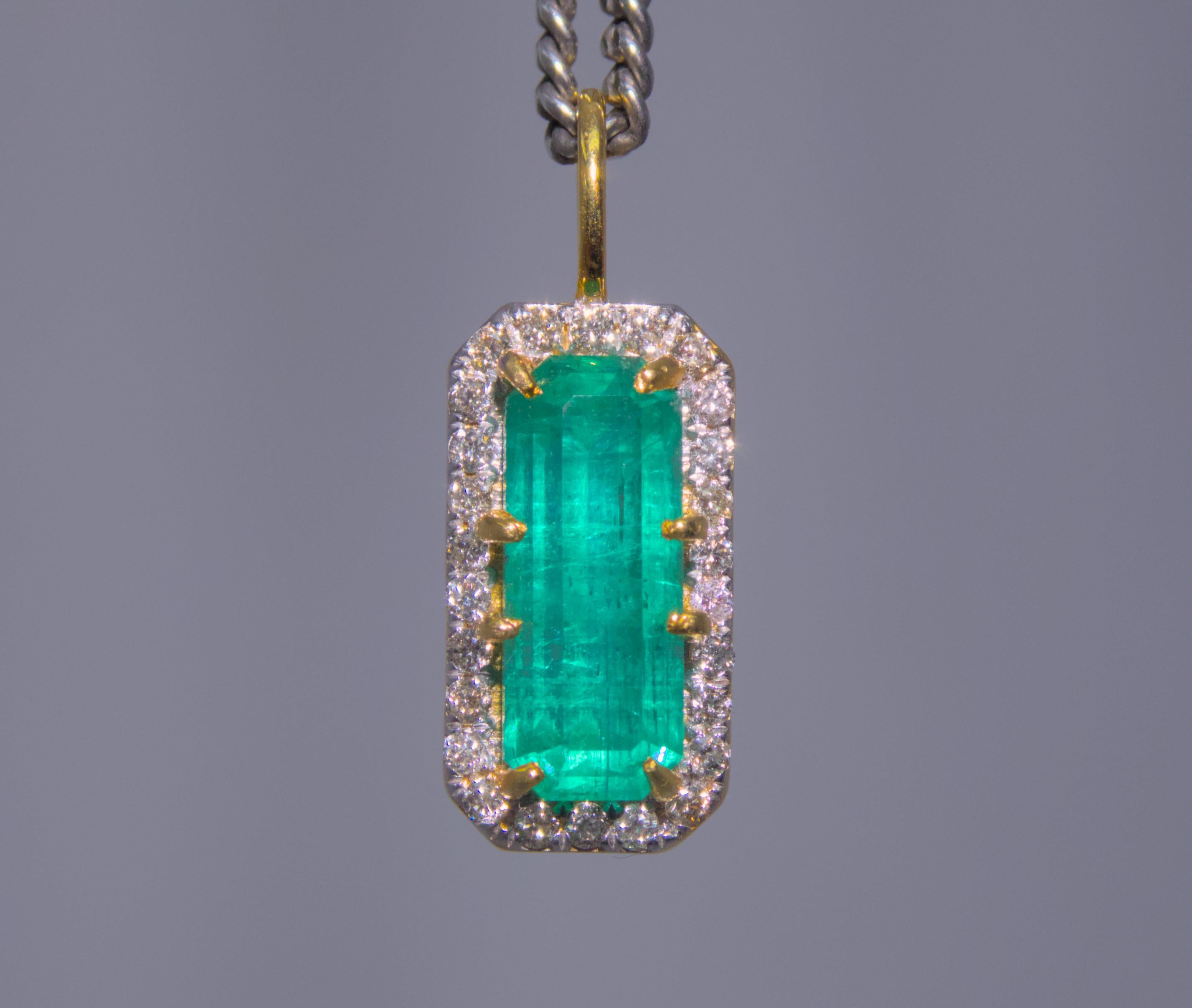 Our stunning Afghan emerald pendant features a 4.72-carat natural emerald surrounded by a sparkling halo of 0.42 carat diamonds. Expertly crafted in 18k yellow gold, this pendant exudes timeless elegance and is the perfect addition to any jewelry