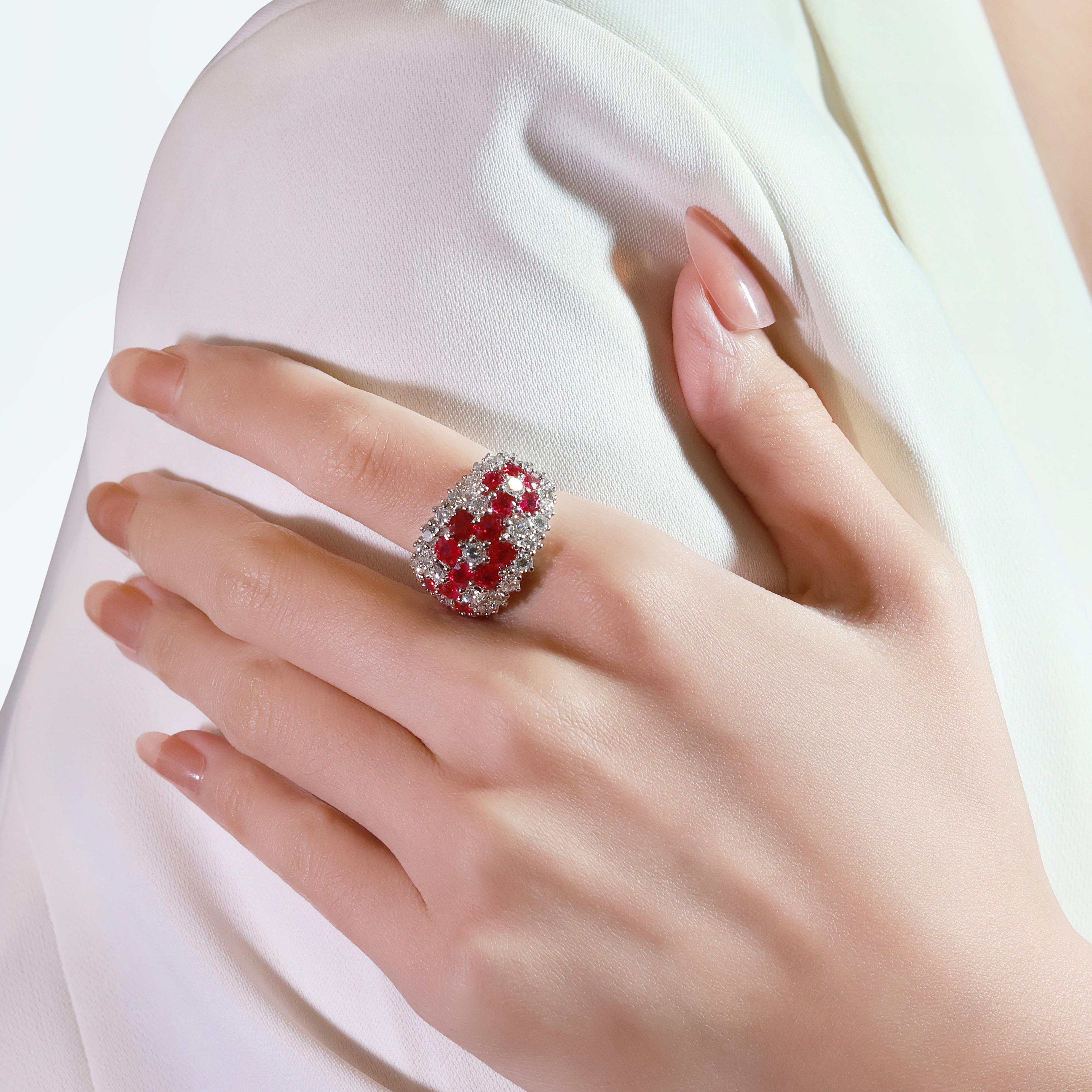 Experience timeless elegance with this extraordinary ring, meticulously crafted from luxurious platinum. Featuring 16 round brilliant rubies with a total carat weight of 4ct, each stone glows with a vivid red hue. Complementing the rubies are 35
