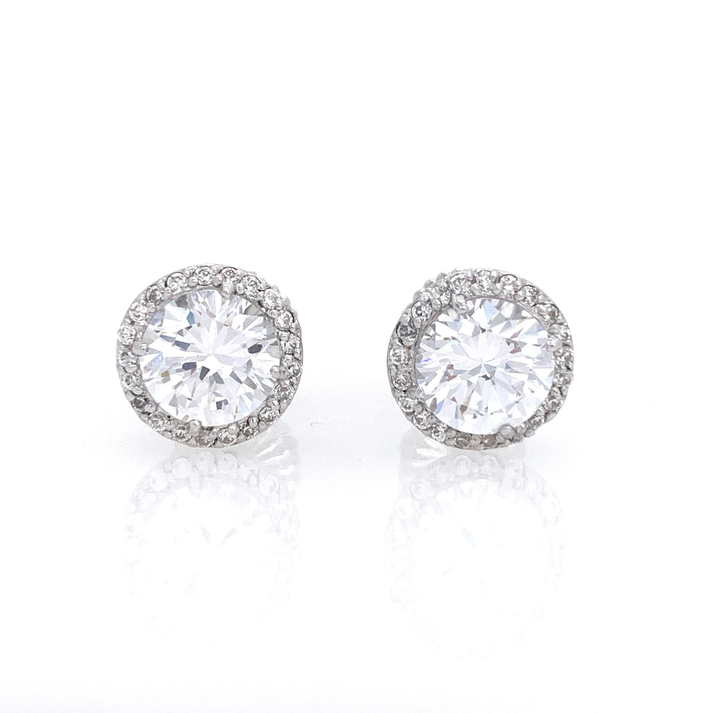 Stunning 4ct Simulated Diamond Halo Stud Sterling Silver Earrings

The earrings feature 2 top quality brilliant-cut round simulated diamonds (2ct each) - 4carat total weight, surrounded with round stones, handset in platinum rhodium plated sterling