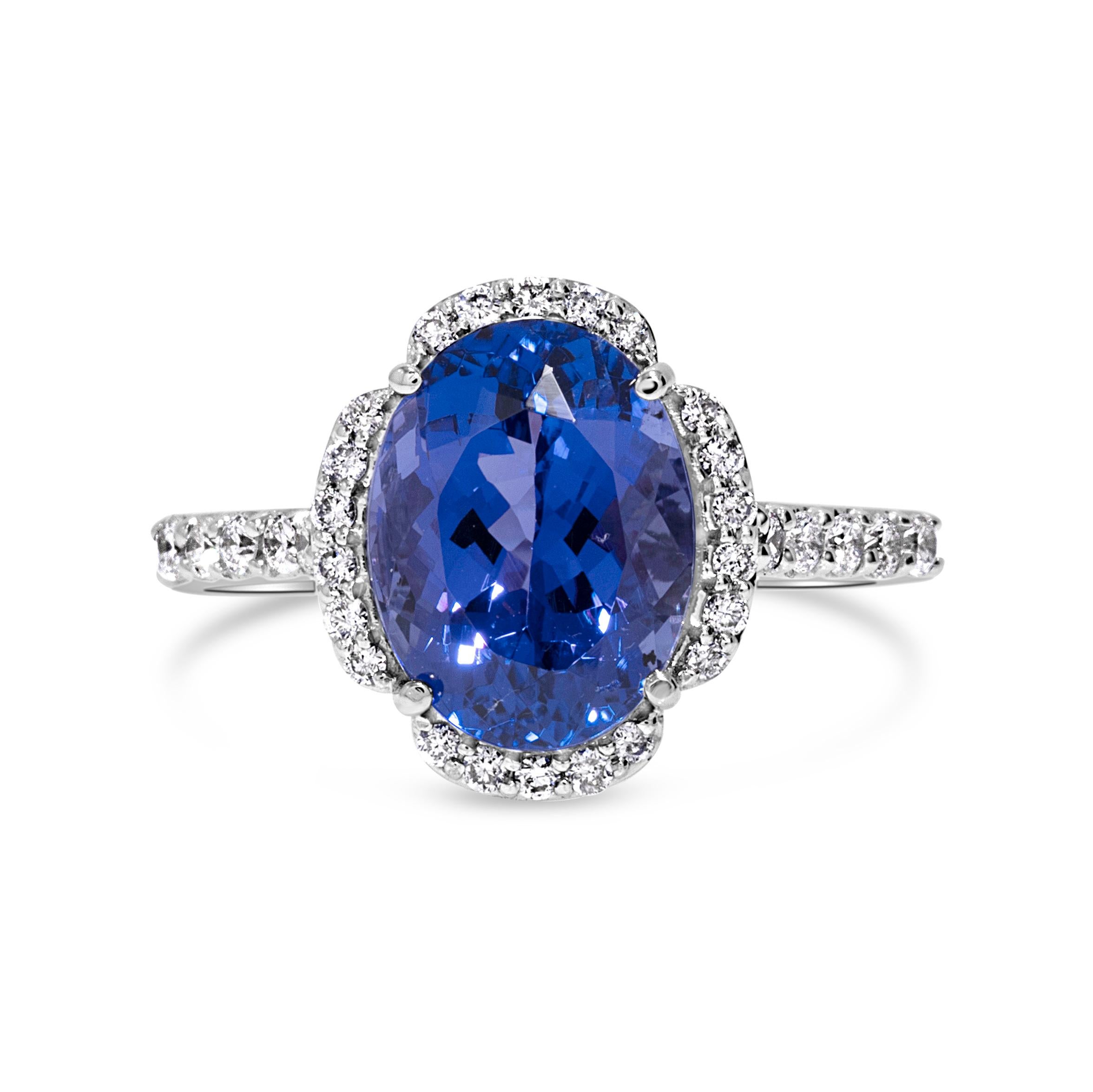 Contemporary Stunning 5 Carat Blue Oval Tanzanite & Diamond Fashion Ring in 14k White Gold For Sale
