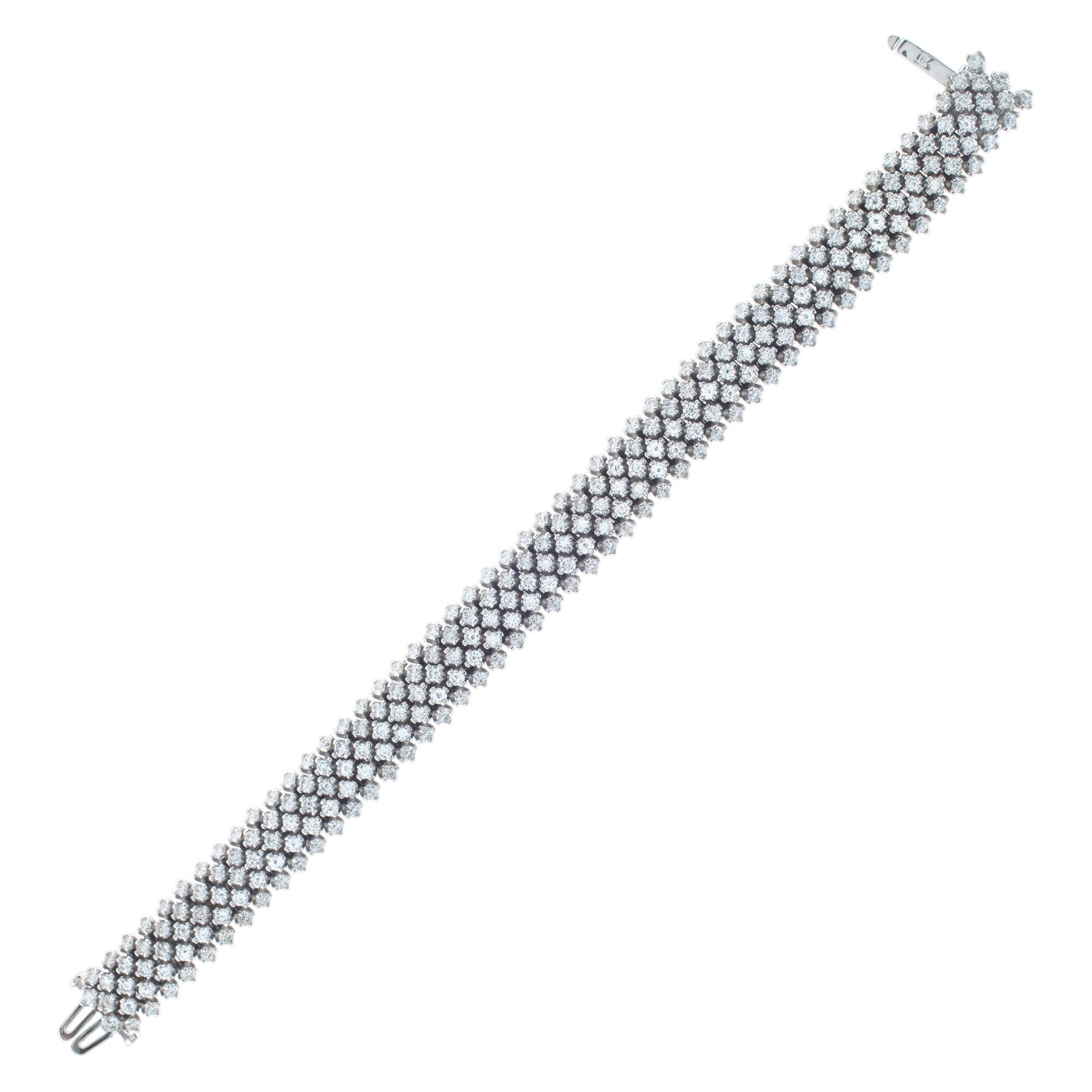 Stunning 5 rows diamond line bracelet in 18k white gold. 258 full cut round brilliant diamonds total weight over 9 carats, estimate: G-H color, VS-SI clarity. Length: 6.75'', width: 11mm.