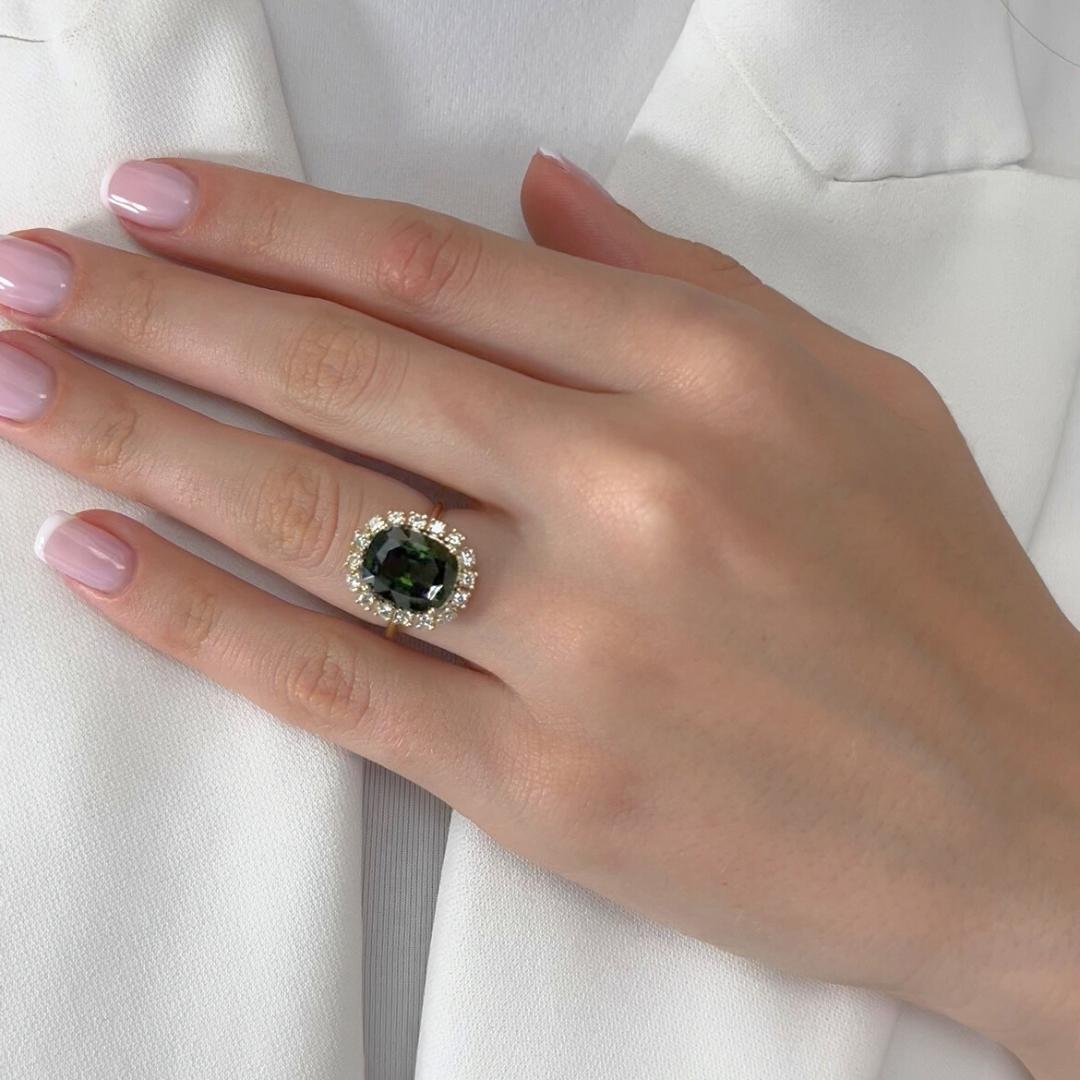Stunning 6.23ct Zircon and Diamonds Cocktail Ring in 14k Yellow Gold - GIA Certified

Elevate your style with this 14k yellow gold cocktail ring, featuring a captivating 5.78ct cushion-cut green zircon. Radiating vibrant color and brilliance, this