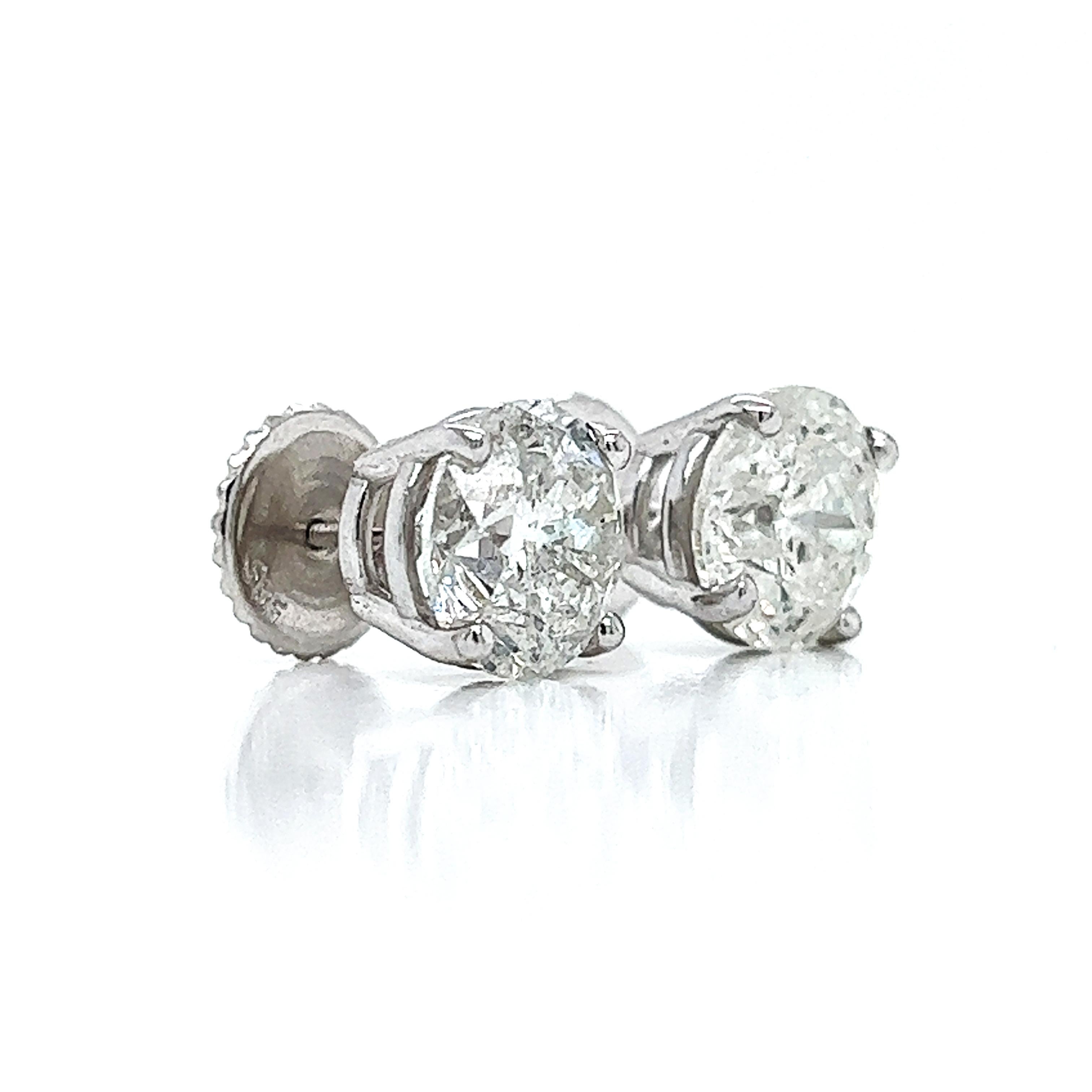 Description:
Product Overview:
Adorn yourself with these exquisite 6.27-carat natural diamond stud earrings, expertly set in 14k white gold. These women's earrings feature a timeless design with a 9.20mm diameter, offering both elegance and
