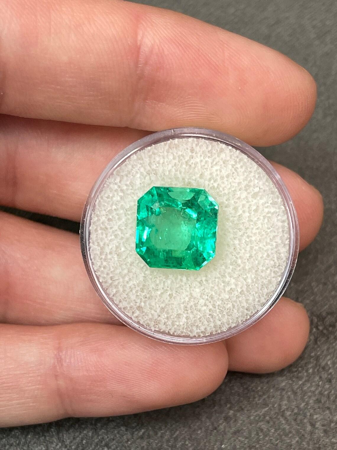 Stone: Emerald
Weight: 6.40-carats
Shape: Asscher Cut
Clarity: Transparent
Luster: Excellent
Color: Vivid Green
Measurements: 10.9mm x 10.8mm
Geographic Origin: Colombia
Treatment: Natural, Oiling

Comments: Due to their growth conditions in nature