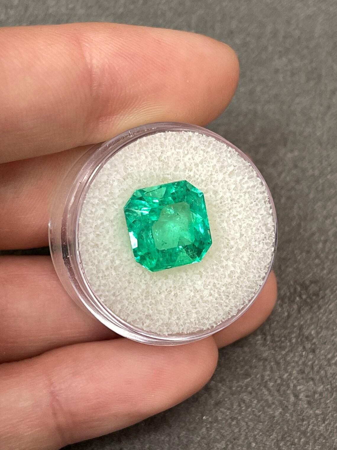 Art Deco Stunning 6.40 Carat Asscher Cut Vivid Muzo Green Colombian Emerald For Sale