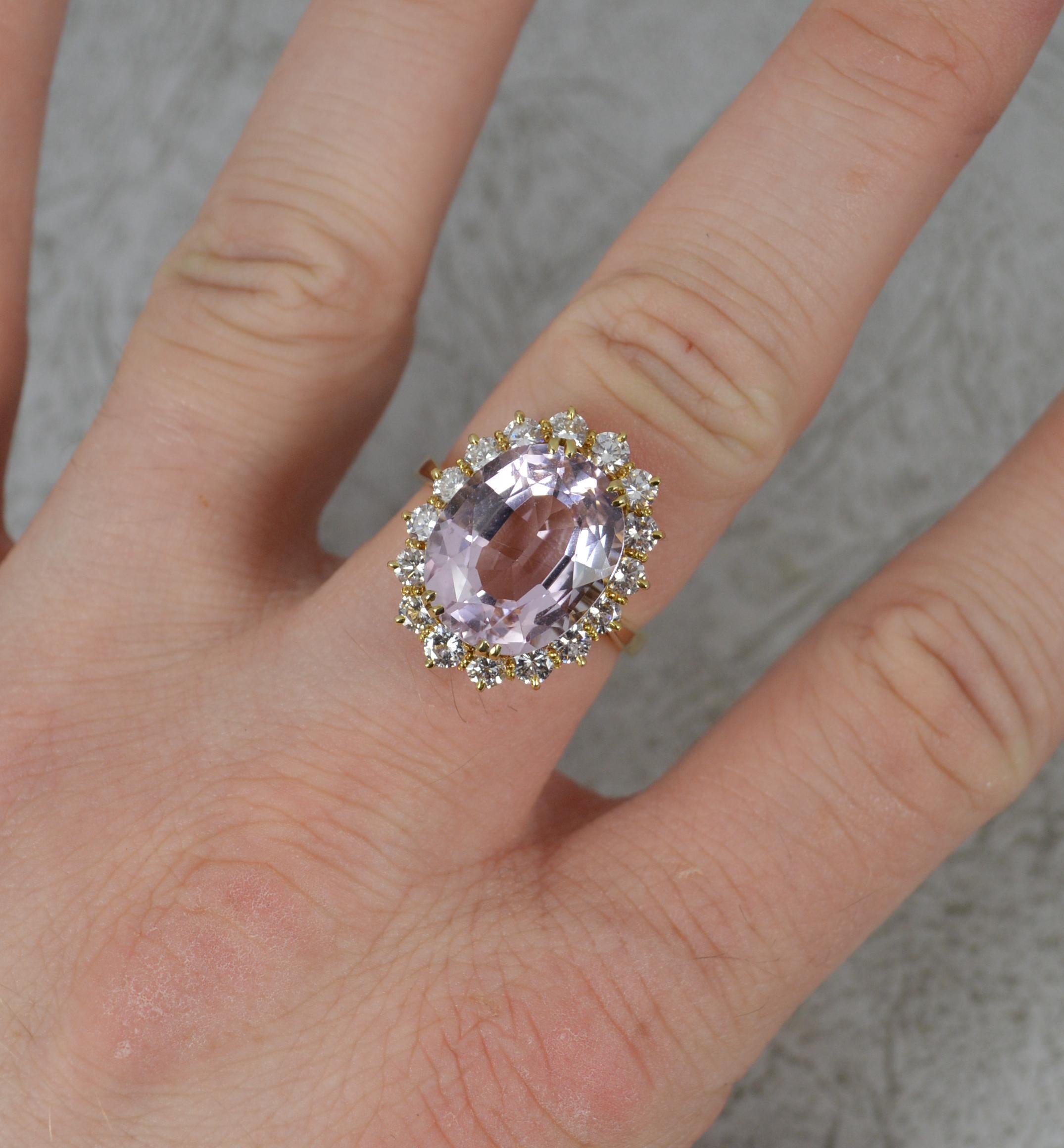A wonderful classic cluster ring.
Solid 18 carat yellow gold shank and setting.
Designed with a natural, oval shaped pink topaz to centre. Set into a four double claw mount. 11.4mm x 14.2mm approx 6.5cts. Sixteen natural round brilliant cut diamonds