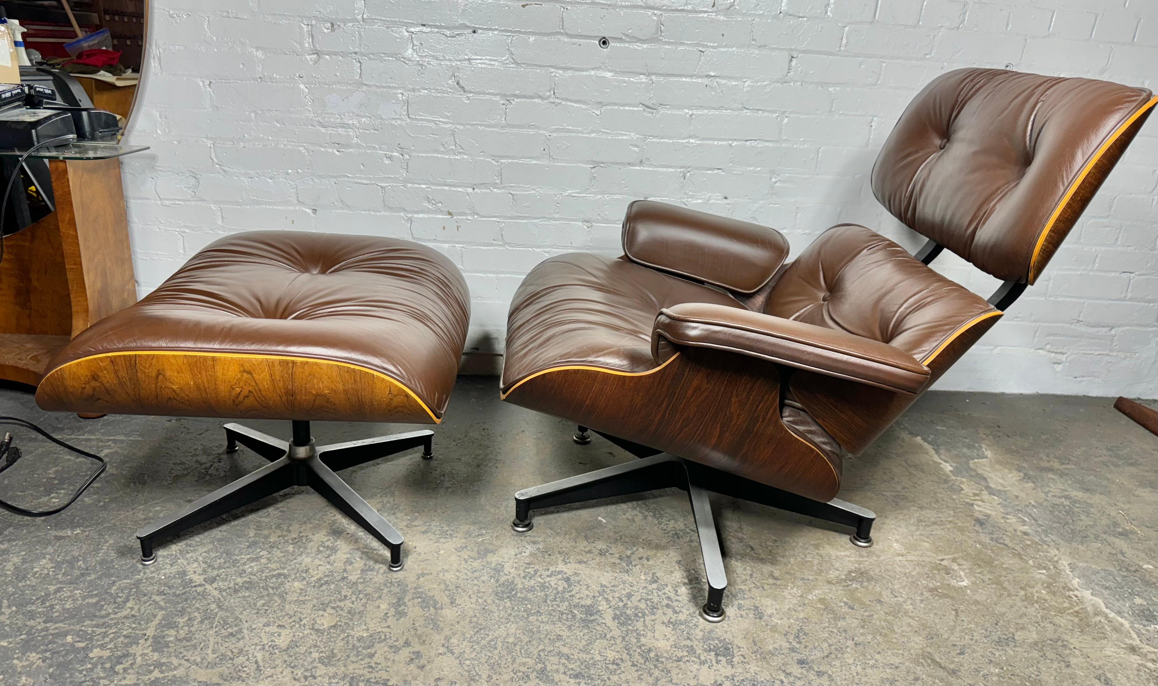 Handsome Modern Classic 70's Eames lounge chair and ottoman. Executed in rosewood and chocolate brown leather. Cast aluminum bases, with adjustable “domes of silence” leveling glides. Extremely comfortable down filled cushions. Retains original