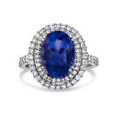 Stunning 7.73 Carat Blue Oval Tanzanite & Diamond Ring in 18k White Gold