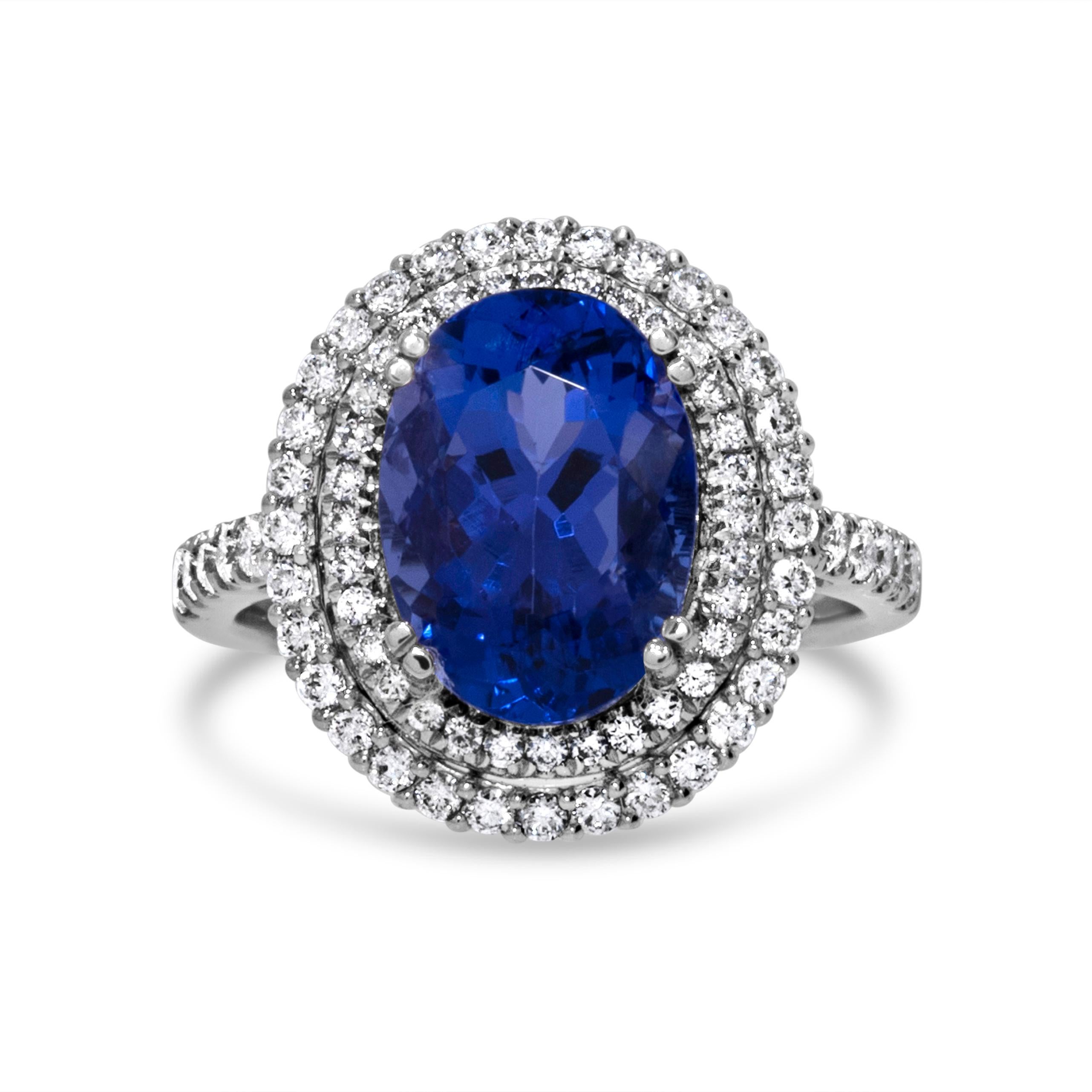 Atemberaubender 7,73 Karat blauer ovaler Tansanit & Diamantring aus 18 Karat Weißgold (Ovalschliff) im Angebot