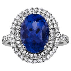 Stunning 7.73 Carat Blue Oval Tanzanite & Diamond Ring in 18k White Gold
