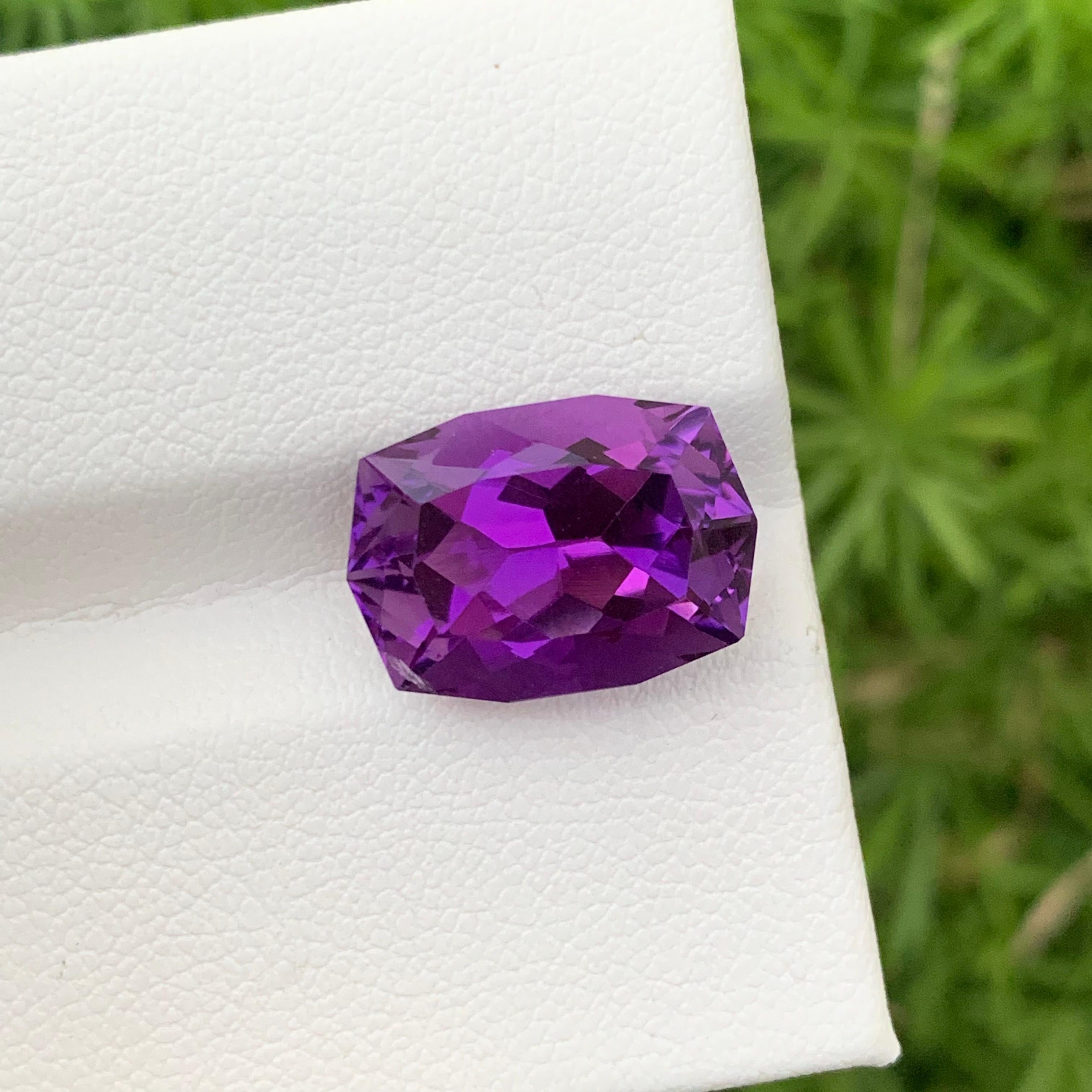 Faceted Amethyst 
Weight: 7.85 Carats 
Origin: Brazil
Shape: Long Cushion
Color: Purple
Certficate: On Customer Demand 
.
Amethyst is a captivating gemstone renowned for its striking purple hues and rich history. This violet to purple variety of