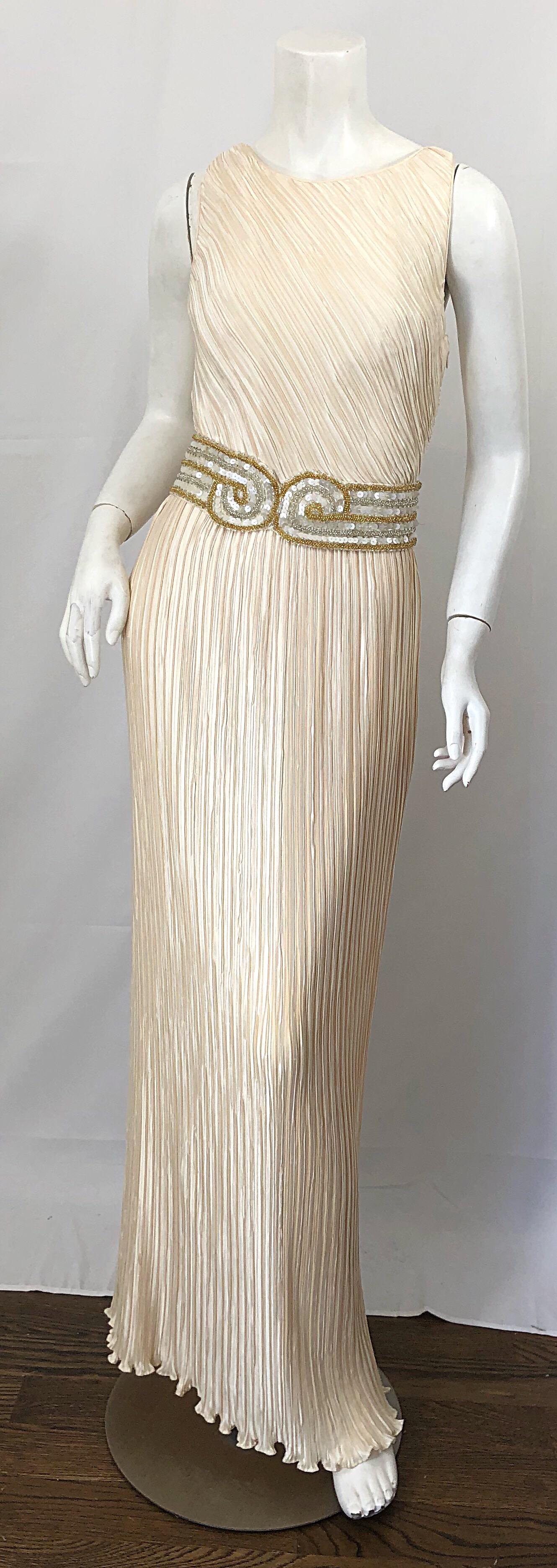 Stunning 1990s does 1920s vintage GEORGE F. COUTURE for LILLIE RUBIN ivory and gold fortune pleated sequin and beaded Grecian gown! Features a flattering fortuney pleated fabric that has so much give. Beaded cross-cross back reveals just the right