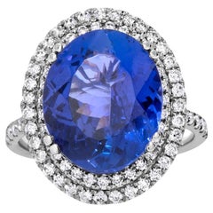 Stupendo anello con tanzanite ovale viola bluastra e diamanti da 9,45 carati in oro bianco 18 carati