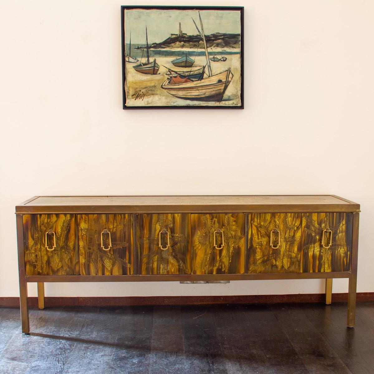 A six-door brass cabinet with acid etched abstract art work to every panel designed by Bernhard Rohne for Mastercraft, 1970s. Each door is complete with an Asian Modern style, brass drop handle.

Mastercraft is synonymous with high style and High